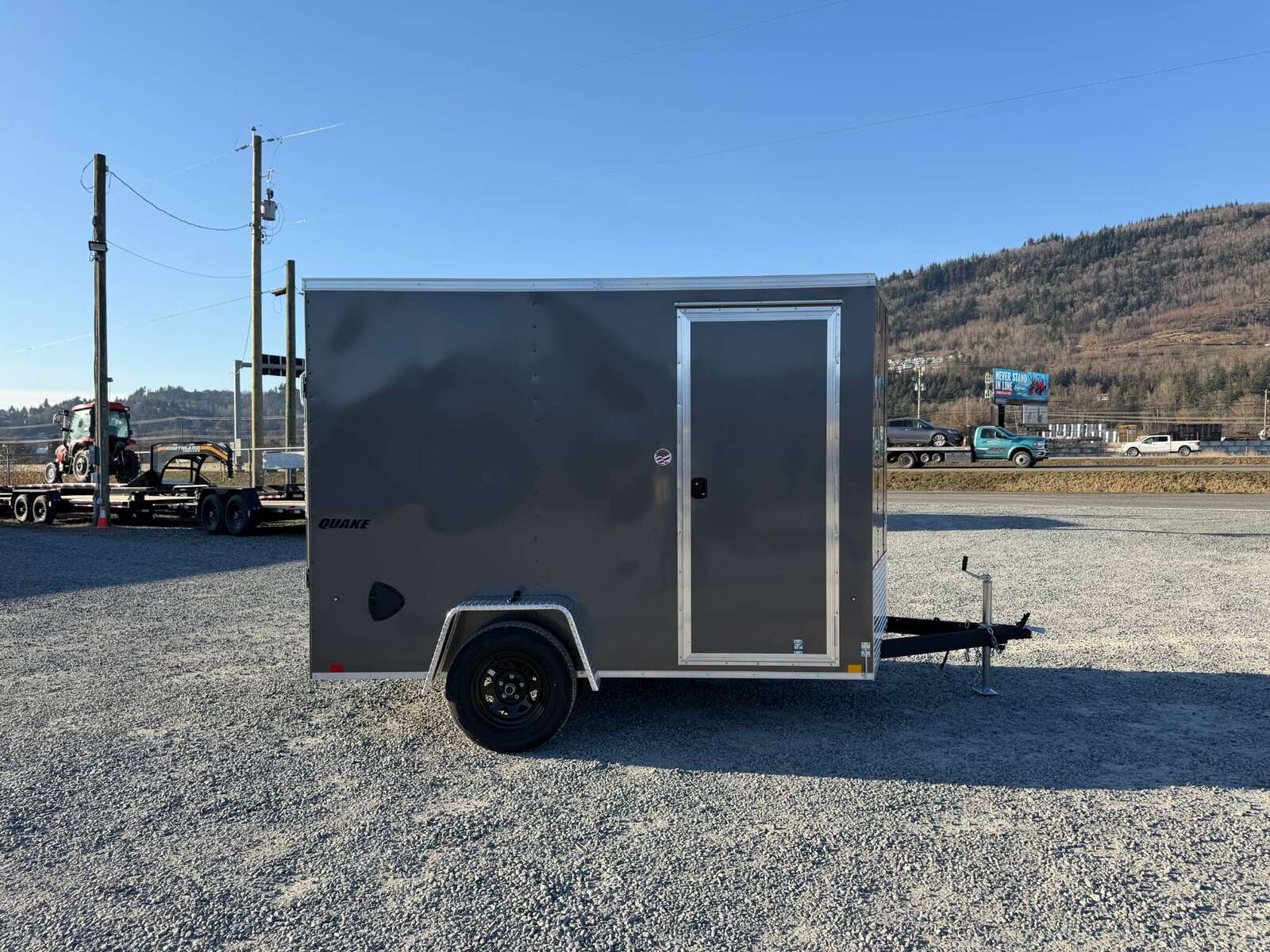 Photo of 2026 Impact Quake 6x10 V Nose Cargo / Enclosed Trailer Charcoal Grey Ramp Door Extra Height 2990lb GVW