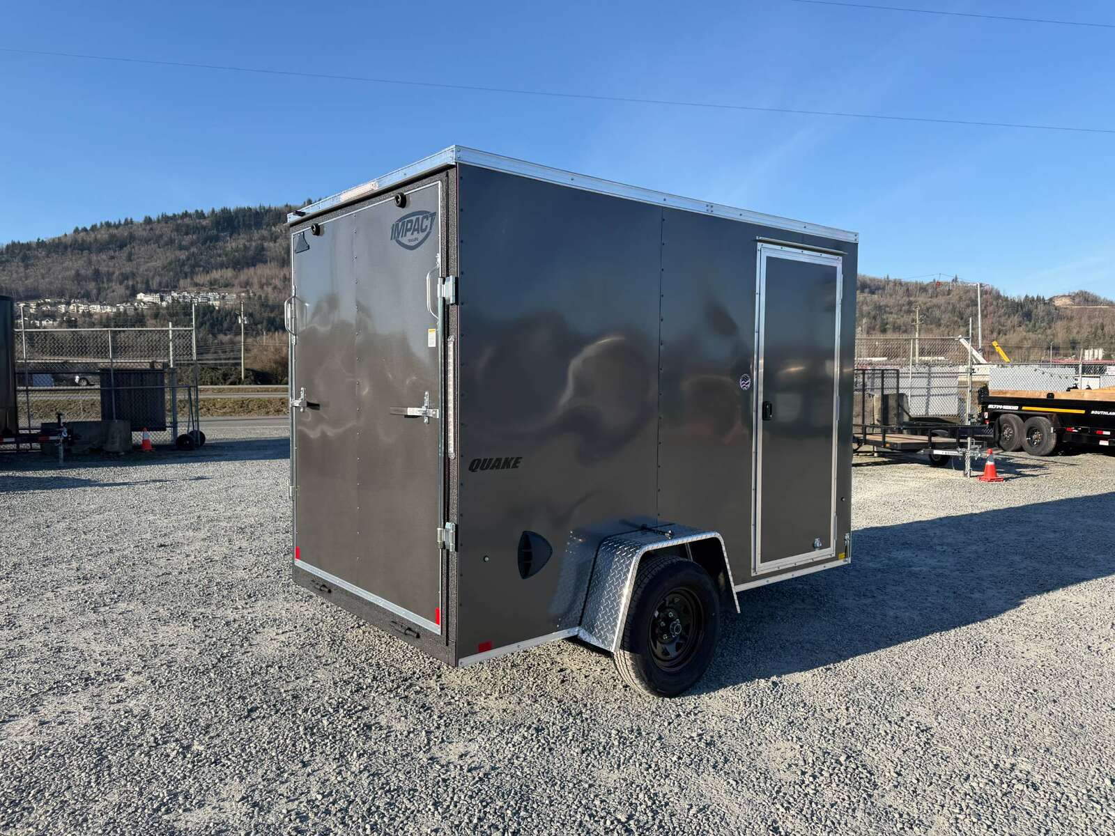 Photo of 2026 Impact Quake 6x10 V Nose Cargo / Enclosed Trailer Charcoal Grey Ramp Door Extra Height 2990lb GVW