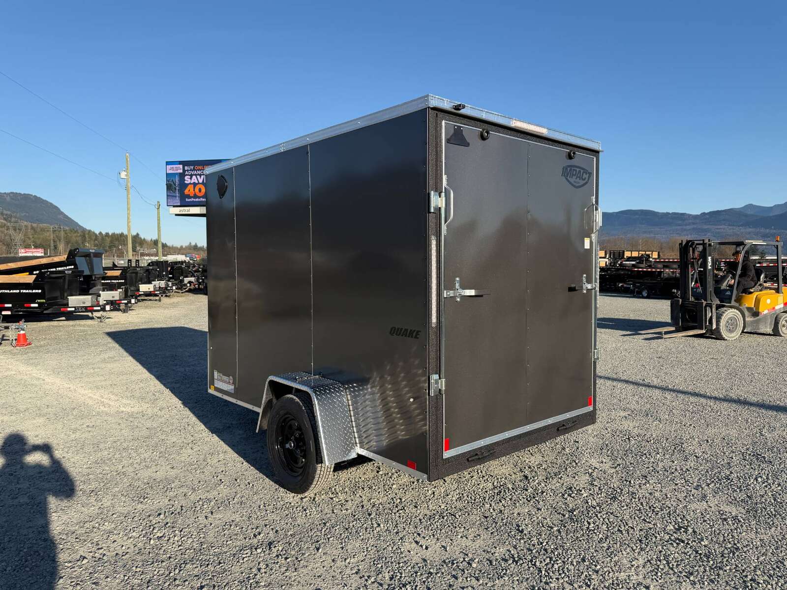 Photo of 2026 Impact Quake 6x10 V Nose Cargo / Enclosed Trailer Charcoal Grey Ramp Door Extra Height 2990lb GVW