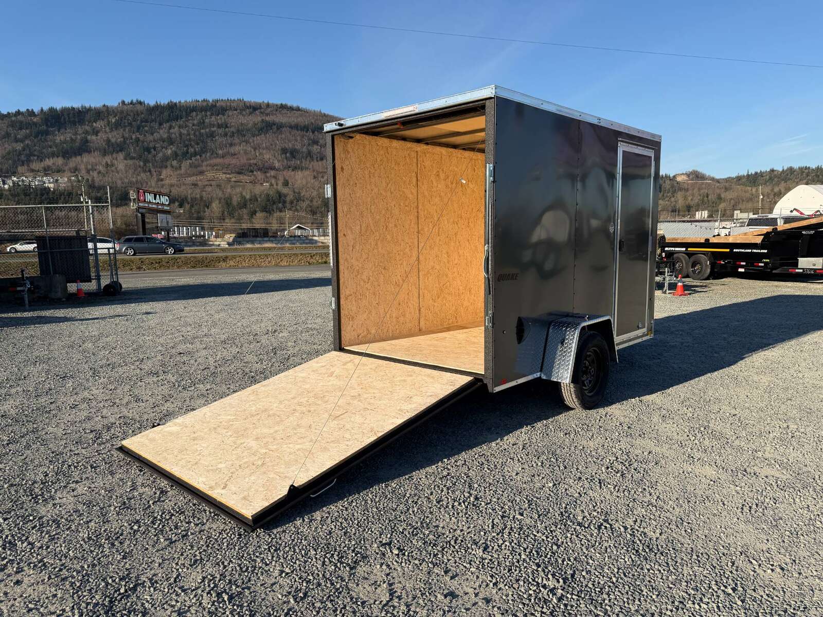 Photo of 2026 Impact Quake 6x10 V Nose Cargo / Enclosed Trailer Charcoal Grey Ramp Door Extra Height 2990lb GVW