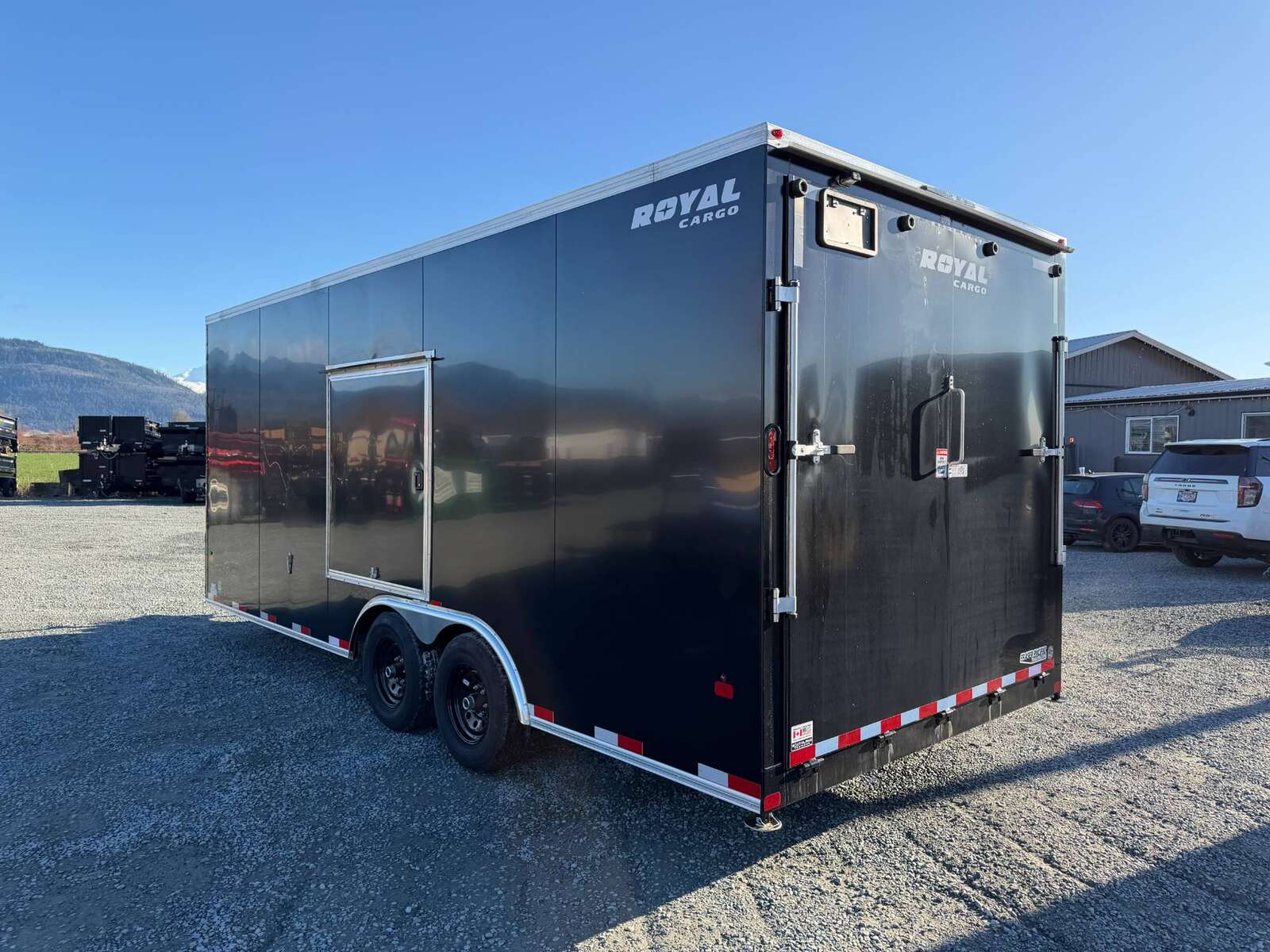 Photo of **DENT SPECIAL** 2026 Royal Cargo 8.5x20 SIDE ESCAPE DOOR +V Nose 11,400lb Cargo / Enclosed Trailer Car Hauler Extra Height Ramp Door Black
