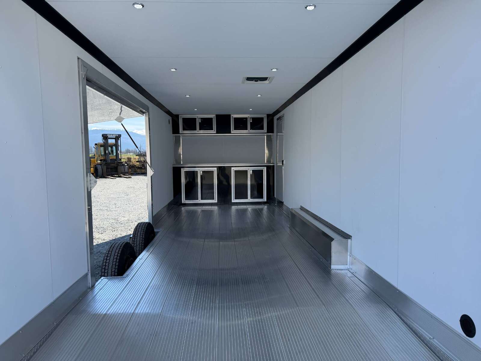 Photo of 2026 ALCOM ALUMINUM 8.5x24 CAR HAULER TRAILER 9900lb GVW WHITE LARGE ESCAPE SIDE DOOR CARGO ENCLOSED