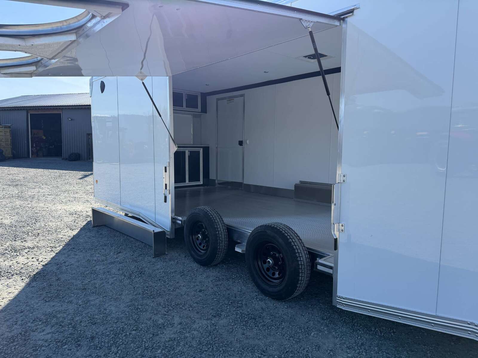 Photo of 2026 ALCOM ALUMINUM 8.5x24 CAR HAULER TRAILER 9900lb GVW WHITE LARGE ESCAPE SIDE DOOR CARGO ENCLOSED