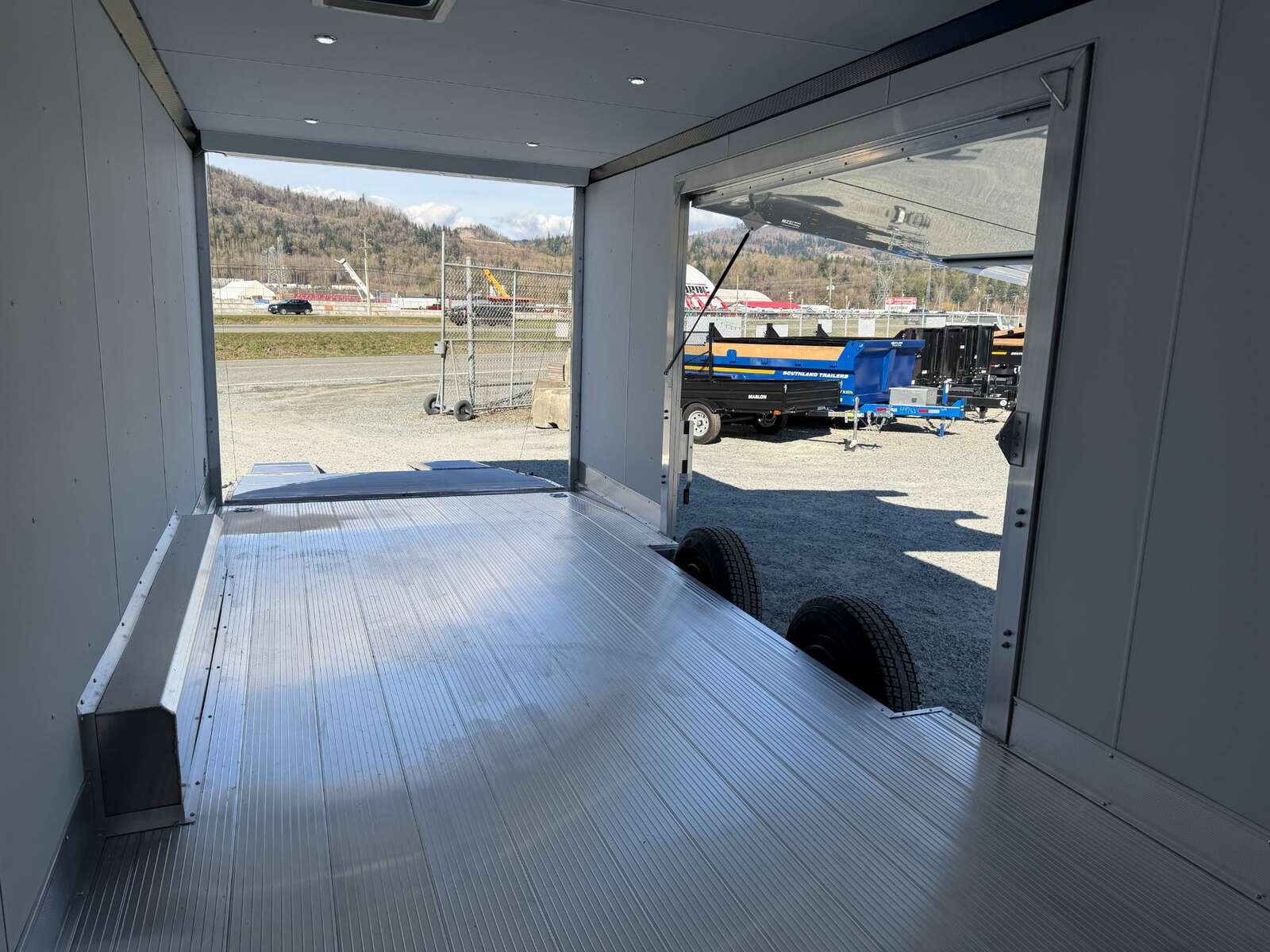 Photo of 2026 ALCOM ALUMINUM 8.5x24 CAR HAULER TRAILER 9900lb GVW WHITE LARGE ESCAPE SIDE DOOR CARGO ENCLOSED