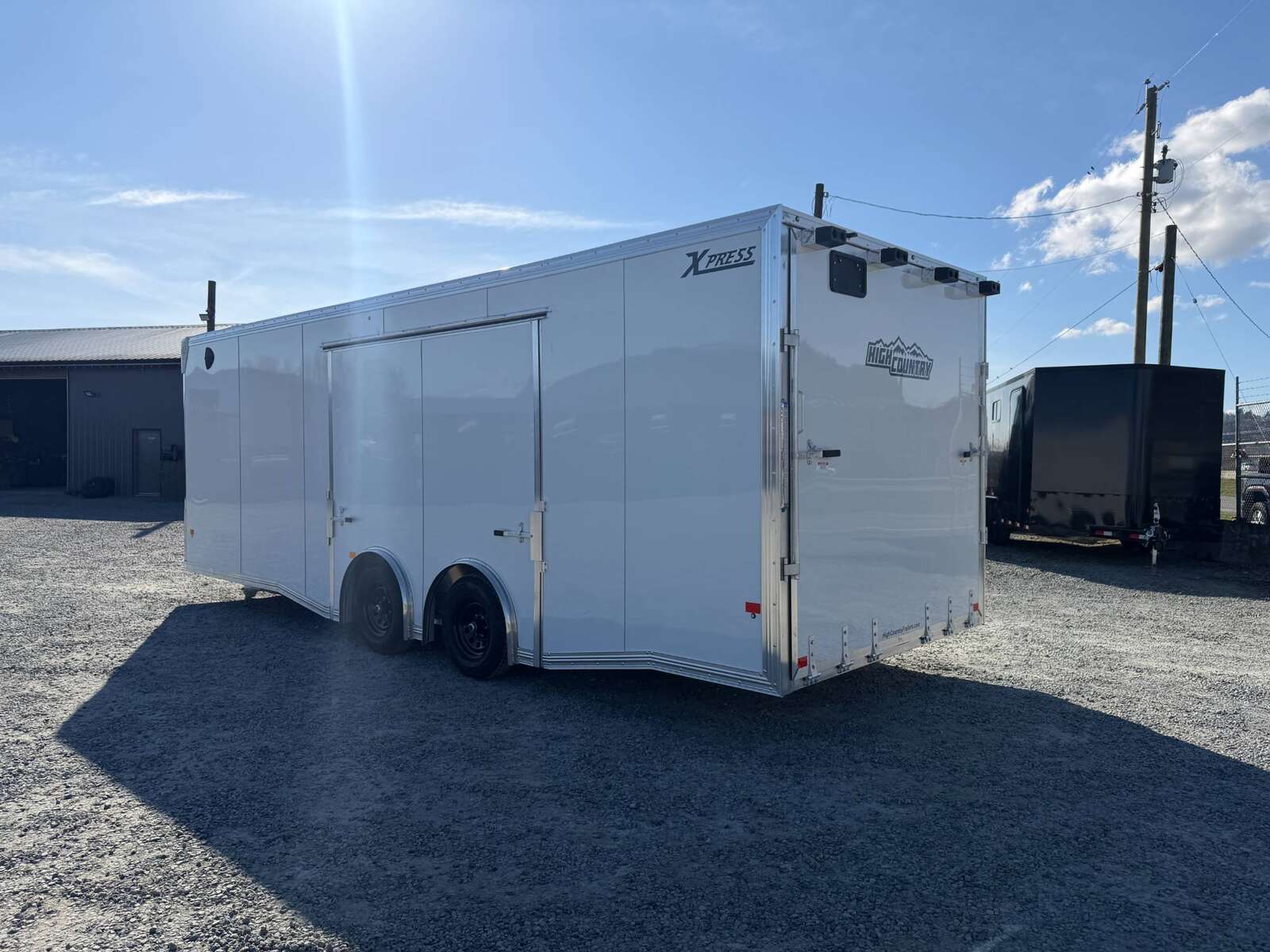Photo of 2026 ALCOM ALUMINUM 8.5x24 CAR HAULER TRAILER 9900lb GVW WHITE LARGE ESCAPE SIDE DOOR CARGO ENCLOSED
