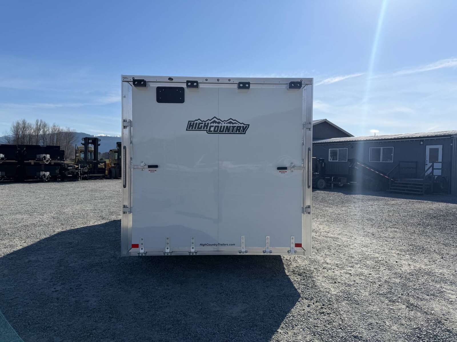 Photo of 2026 ALCOM ALUMINUM 8.5x24 CAR HAULER TRAILER 9900lb GVW WHITE LARGE ESCAPE SIDE DOOR CARGO ENCLOSED