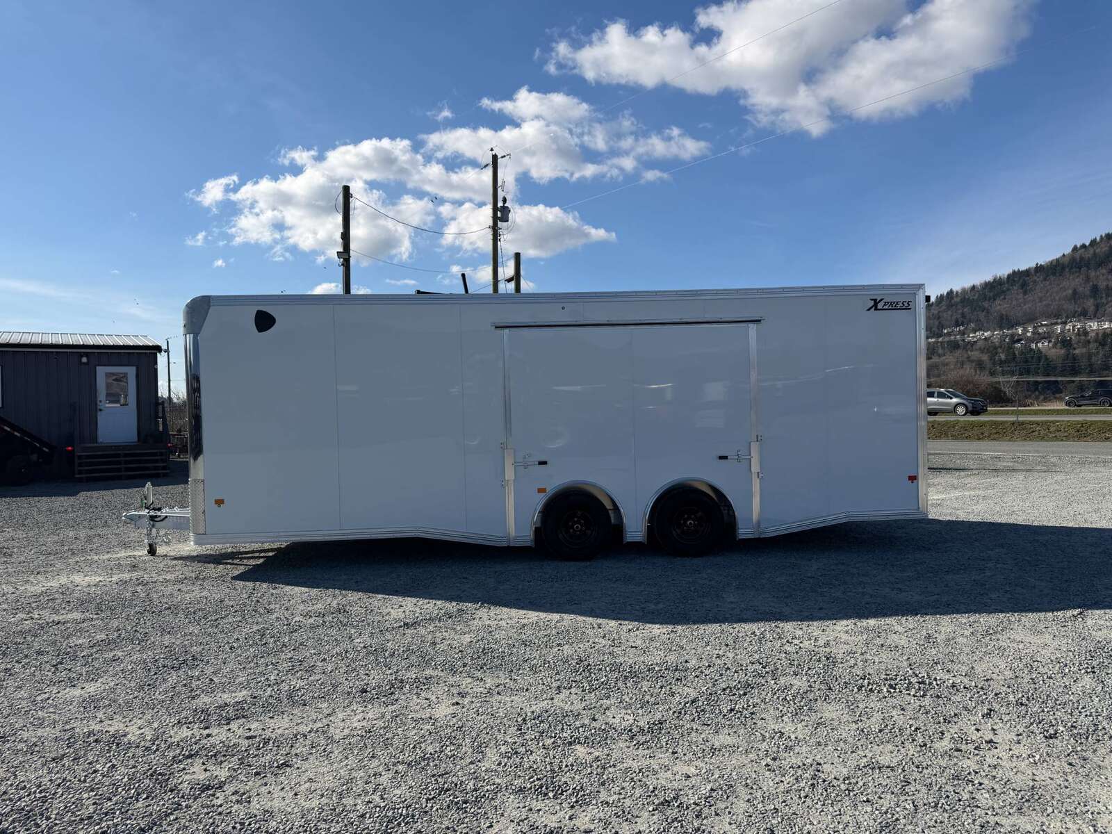 Photo of 2026 ALCOM ALUMINUM 8.5x24 CAR HAULER TRAILER 9900lb GVW WHITE LARGE ESCAPE SIDE DOOR CARGO ENCLOSED