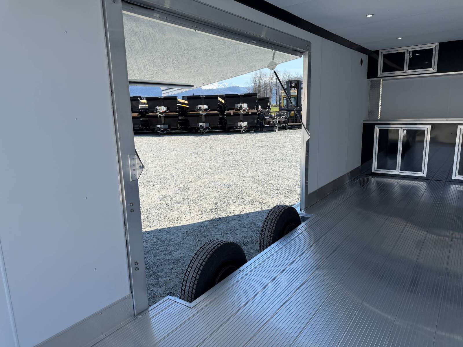 Photo of 2026 ALCOM ALUMINUM 8.5x24 CAR HAULER TRAILER 9900lb GVW WHITE LARGE ESCAPE SIDE DOOR CARGO ENCLOSED