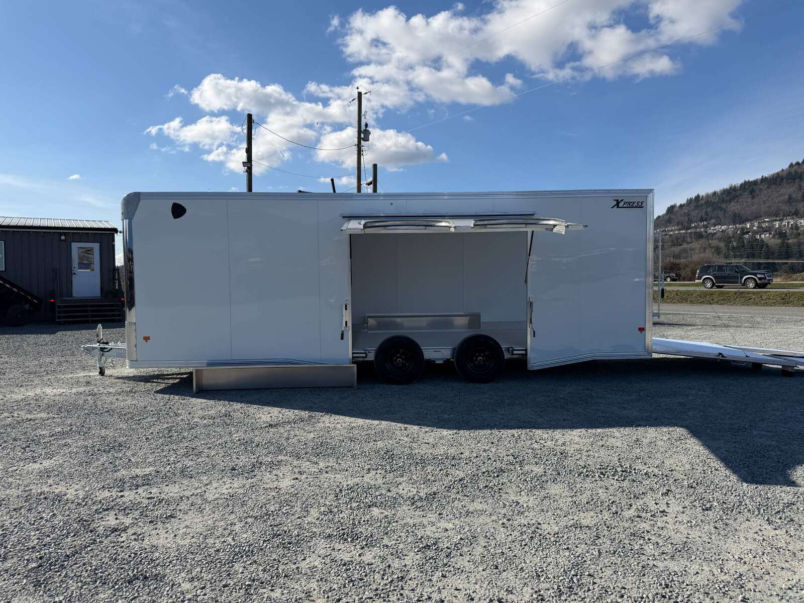 Photo of 2026 ALCOM ALUMINUM 8.5x24 CAR HAULER TRAILER 9900lb GVW WHITE LARGE ESCAPE SIDE DOOR CARGO ENCLOSED