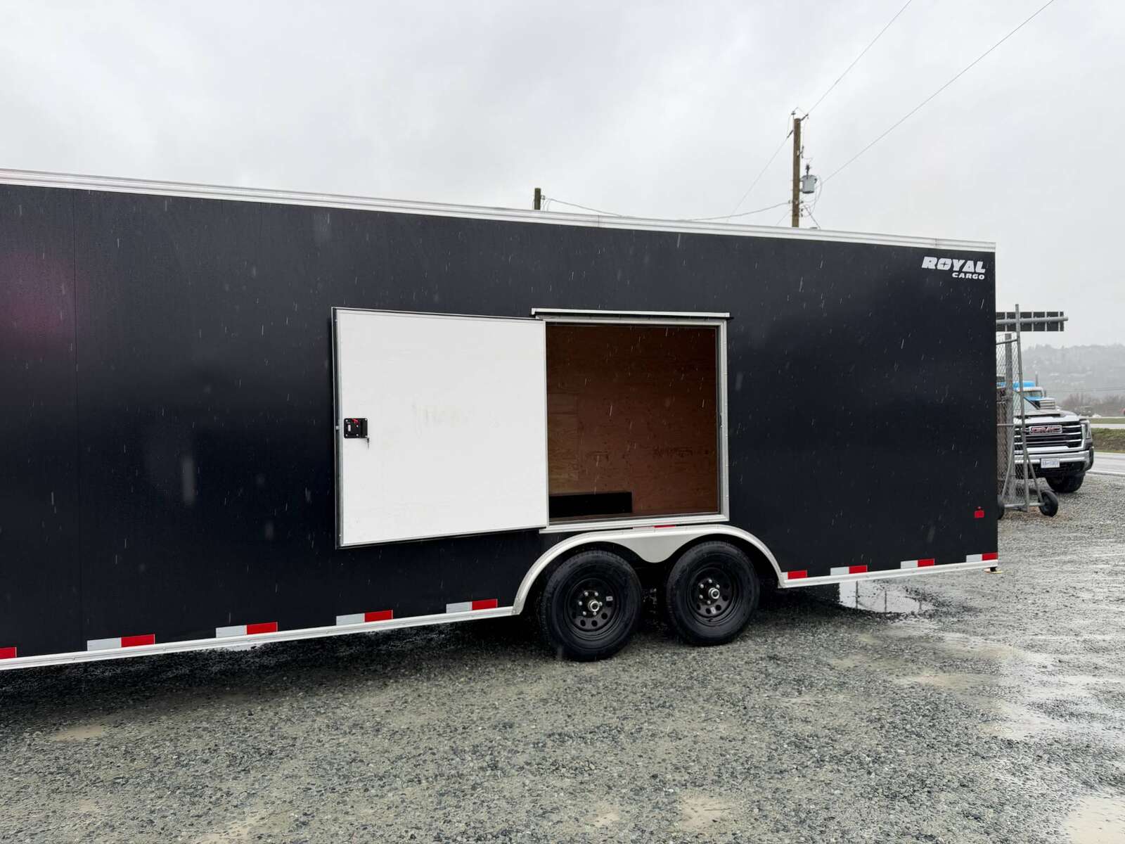 Photo of 2026 Royal Cargo 8.5x24 V Nose Car Hauler Cargo / Enclosed Trailer w/ Side Escape Door 11,400lb GVW Satin Black Ramp Door Extra Height
