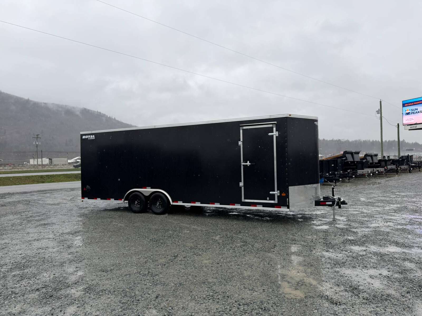 Photo of 2026 Royal Cargo 8.5x24 V Nose Car Hauler Cargo / Enclosed Trailer w/ Side Escape Door 11,400lb GVW Satin Black Ramp Door Extra Height