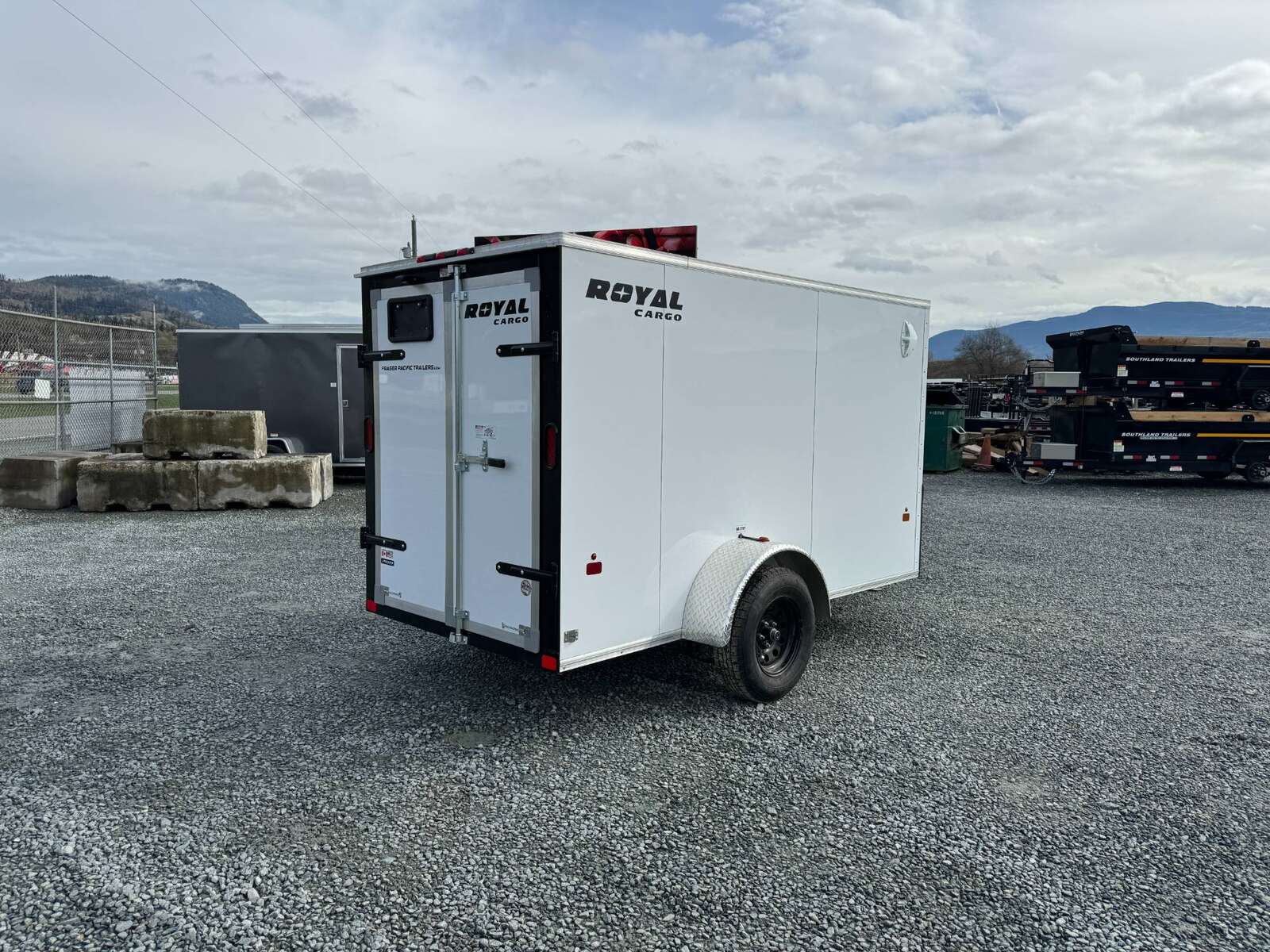 Photo of 2026 Royal Cargo 5x10 Cargo Enclosed Trailer V Nose Barn Doors White