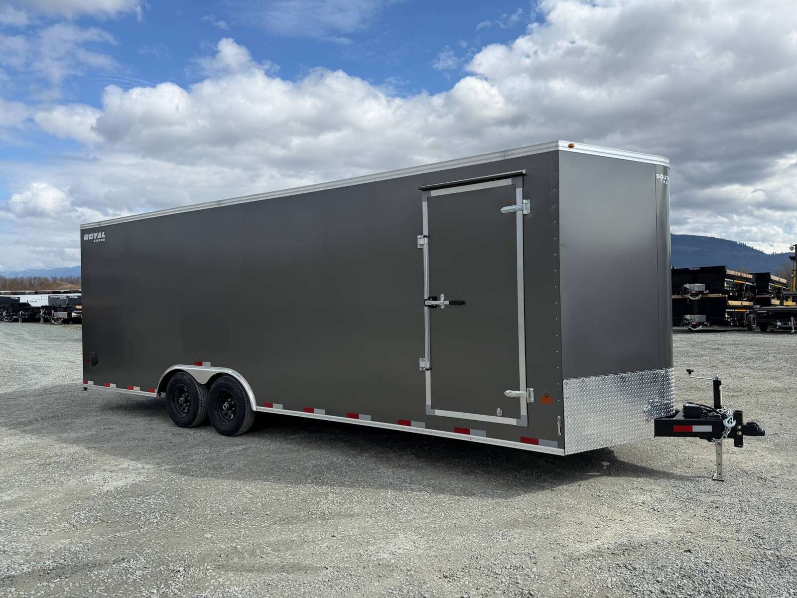 Photo of **SCRATCH SALE** 2026 Royal Cargo 8.5x24 V Nose Car Hauler Cargo / Enclosed Trailer 11,400lb GVW Charcoal Grey Ramp Door Extra Height (GSR)