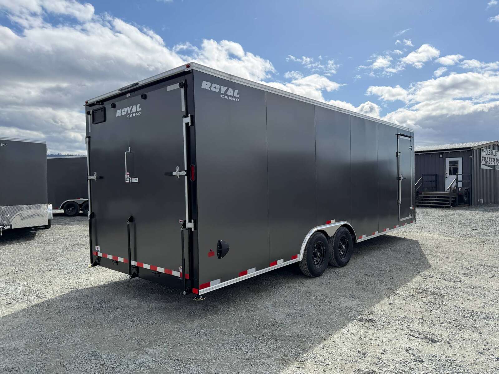 Photo of **SCRATCH SALE** 2026 Royal Cargo 8.5x24 V Nose Car Hauler Cargo / Enclosed Trailer 11,400lb GVW Charcoal Grey Ramp Door Extra Height (GSR)