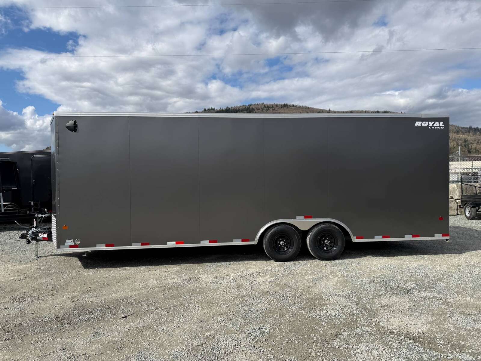 Photo of **SCRATCH SALE** 2026 Royal Cargo 8.5x24 V Nose Car Hauler Cargo / Enclosed Trailer 11,400lb GVW Charcoal Grey Ramp Door Extra Height (GSR)