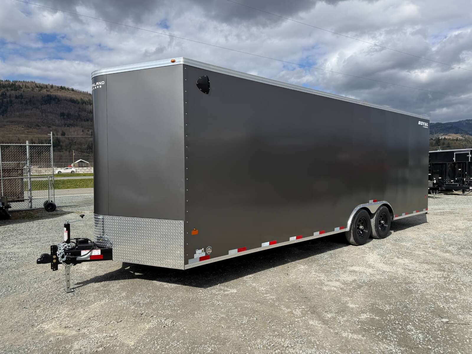 Photo of **SCRATCH SALE** 2026 Royal Cargo 8.5x24 V Nose Car Hauler Cargo / Enclosed Trailer 11,400lb GVW Charcoal Grey Ramp Door Extra Height (GSR)