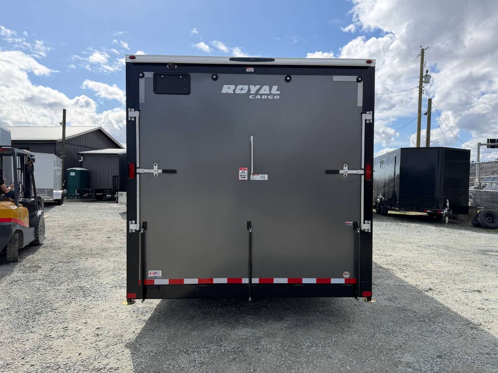 Photo of **SCRATCH SALE** 2026 Royal Cargo 8.5x24 V Nose Car Hauler Cargo / Enclosed Trailer 11,400lb GVW Charcoal Grey Ramp Door Extra Height (GSR)