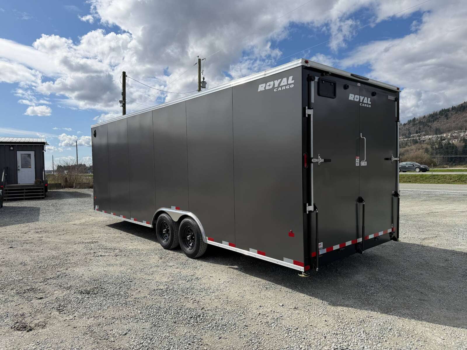 Photo of **SCRATCH SALE** 2026 Royal Cargo 8.5x24 V Nose Car Hauler Cargo / Enclosed Trailer 11,400lb GVW Charcoal Grey Ramp Door Extra Height (GSR)