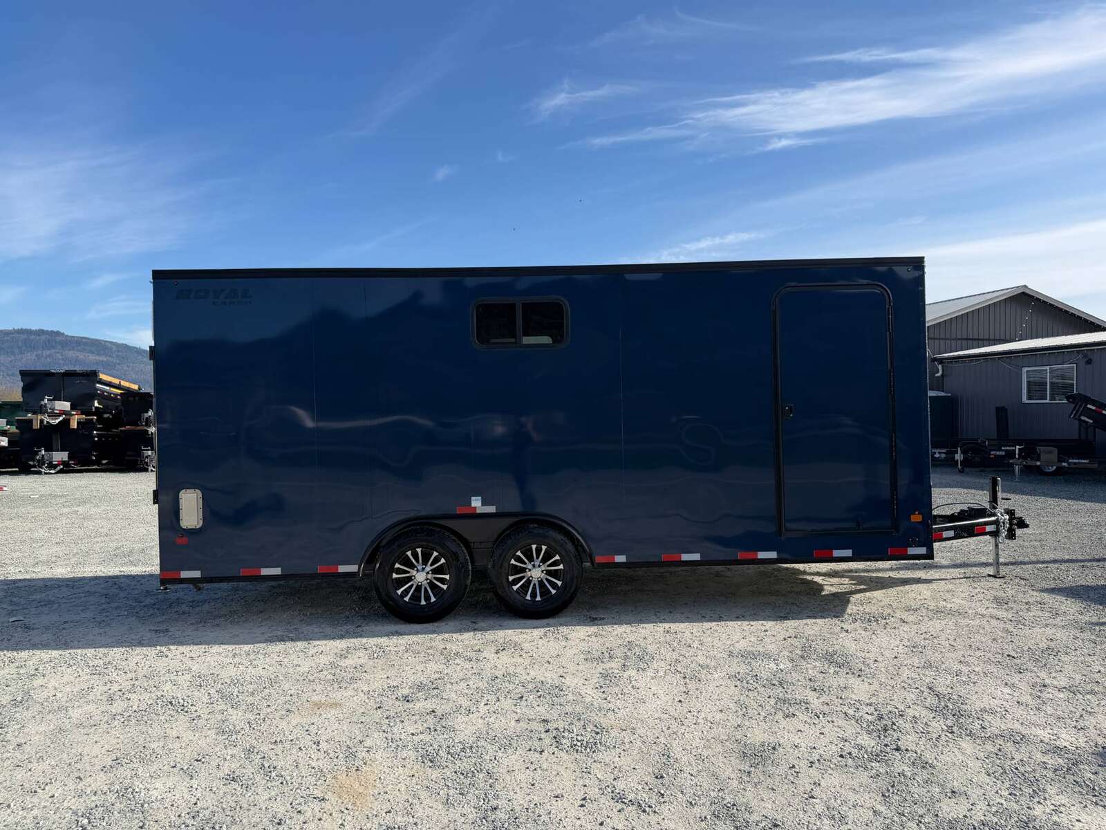 Photo of 2026 Royal 8.5x20 V Nose Cargo Enclosed Trailer Camping Package Blue w/ Blackout Pkg, Insulated, Ramp Door, White Walls, 2x Windows & More!