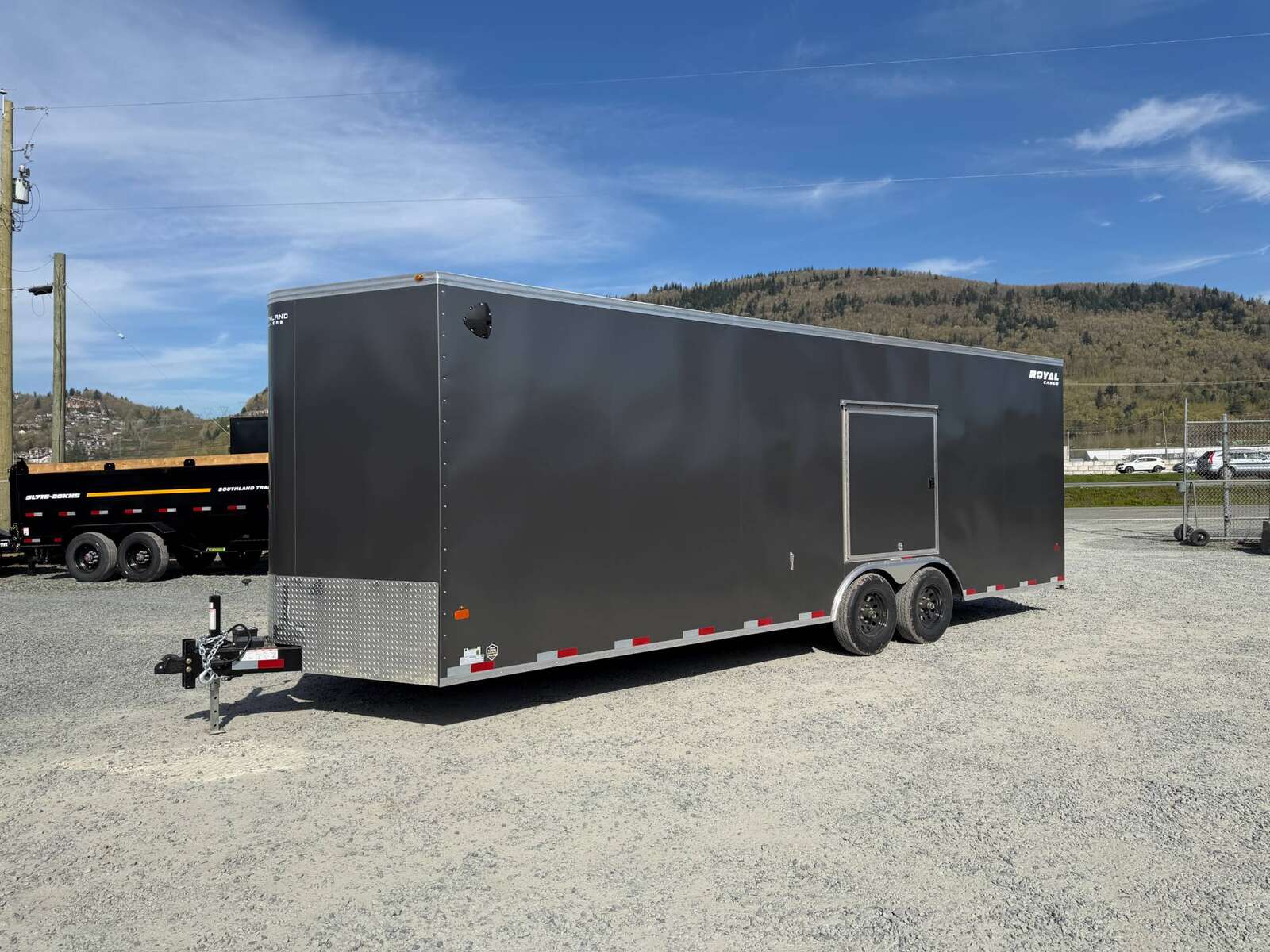 Photo of 2026 Royal Cargo 8.5x24 V Nose Car Hauler Cargo / Enclosed Trailer w/ Side Escape Door 11,400lb GVW Charcoal Grey Ramp Door Extra Height