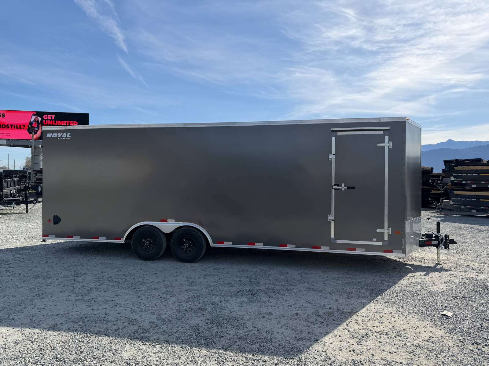 Photo of 2026 Royal Cargo 8.5x24 V Nose Car Hauler Cargo / Enclosed Trailer w/ Side Escape Door 11,400lb GVW Charcoal Grey Ramp Door Extra Height