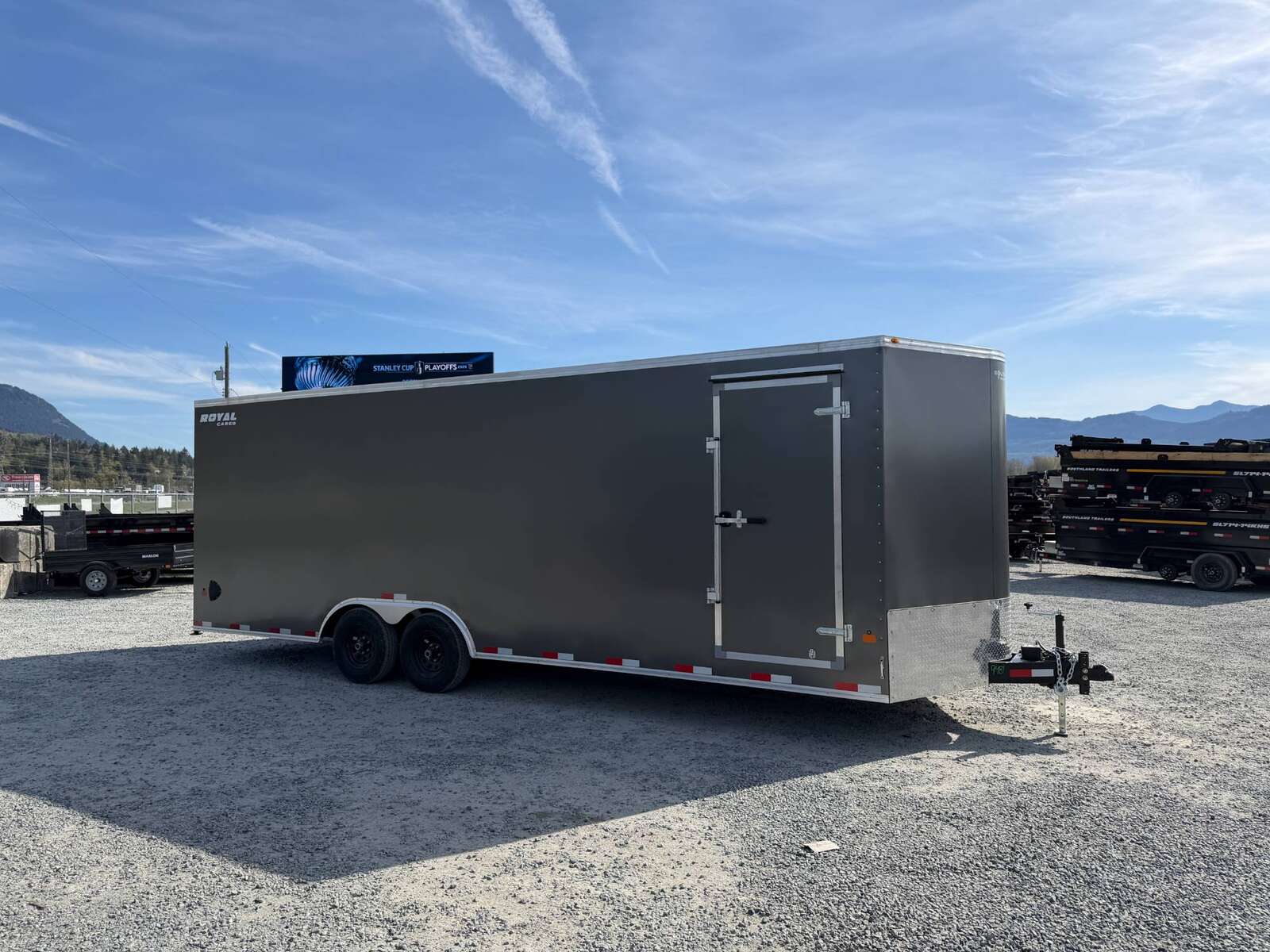 Photo of 2026 Royal Cargo 8.5x24 V Nose Car Hauler Cargo / Enclosed Trailer w/ Side Escape Door 11,400lb GVW Charcoal Grey Ramp Door Extra Height