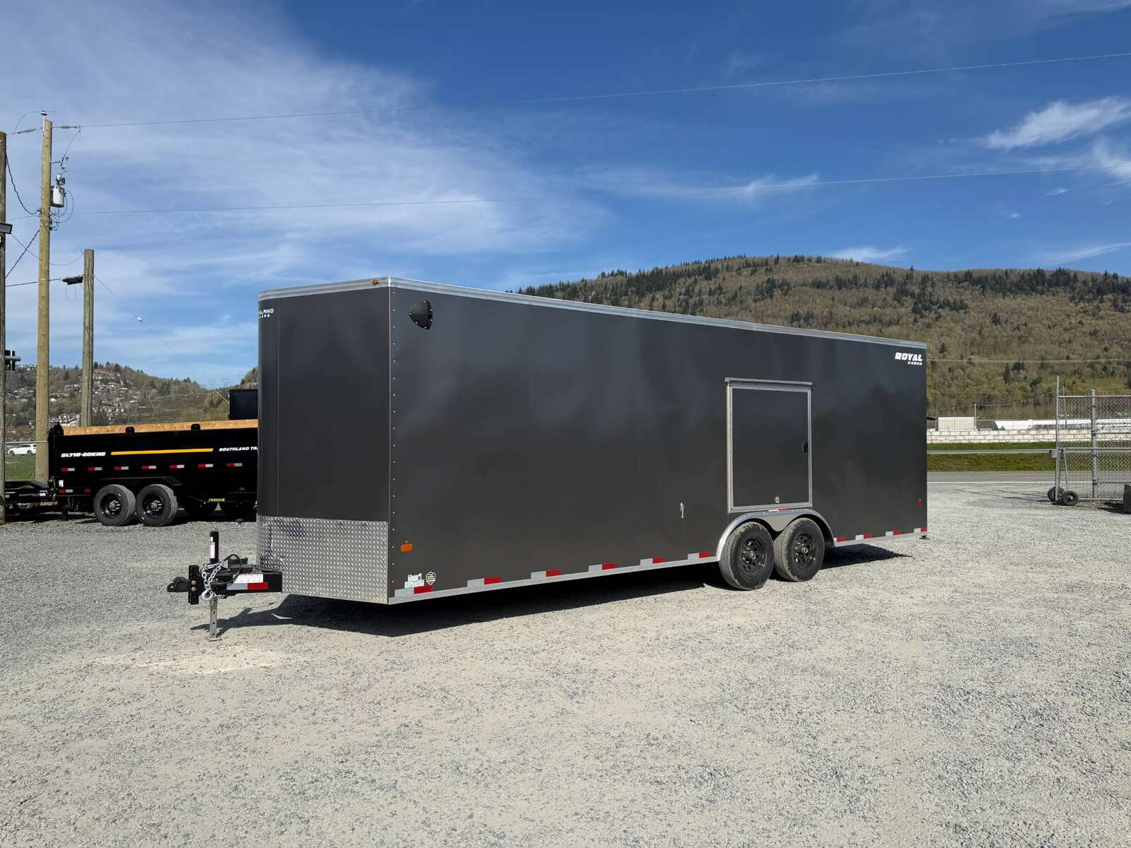 Photo of 2026 Royal Cargo 8.5x24 V Nose Car Hauler Cargo / Enclosed Trailer w/ Side Escape Door 11,400lb GVW Charcoal Grey Ramp Door Extra Height