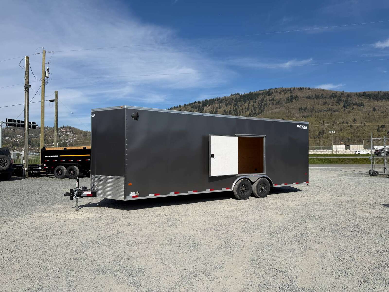 Photo of 2026 Royal Cargo 8.5x24 V Nose Car Hauler Cargo / Enclosed Trailer w/ Side Escape Door 11,400lb GVW Charcoal Grey Ramp Door Extra Height