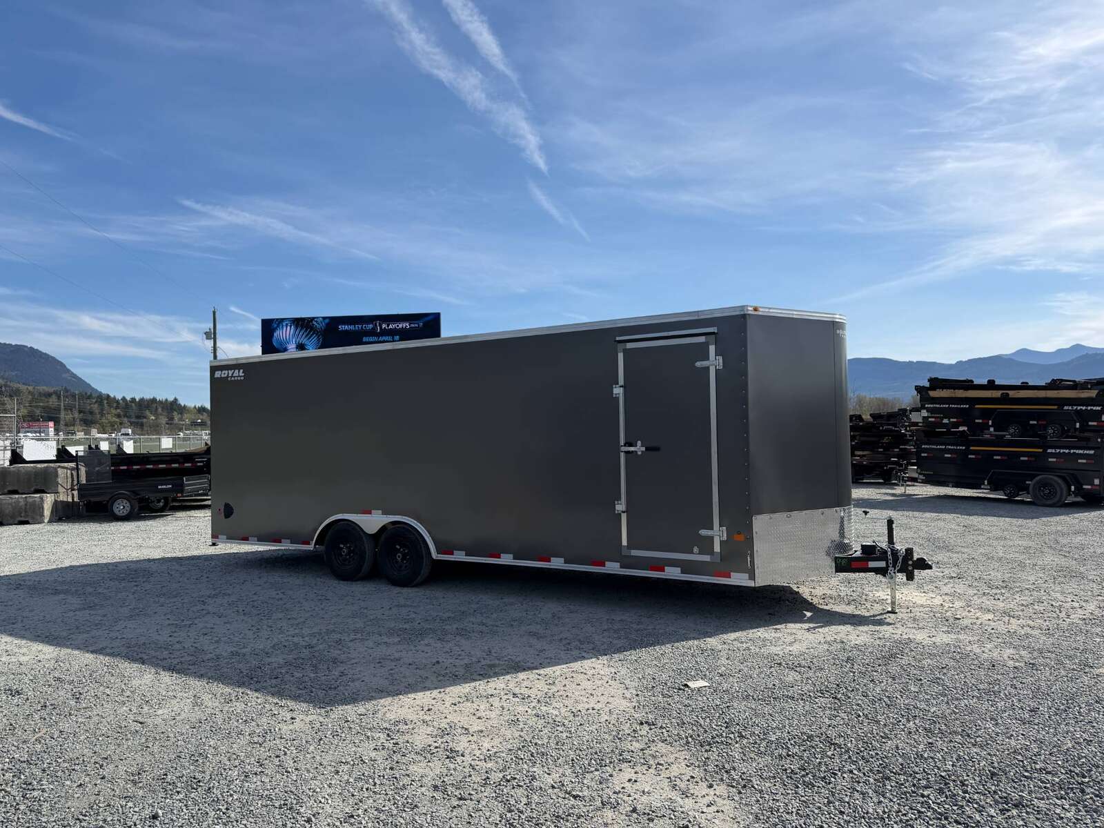 Photo of 2026 Royal Cargo 8.5x24 V Nose Car Hauler Cargo / Enclosed Trailer w/ Side Escape Door 11,400lb GVW Charcoal Grey Ramp Door Extra Height