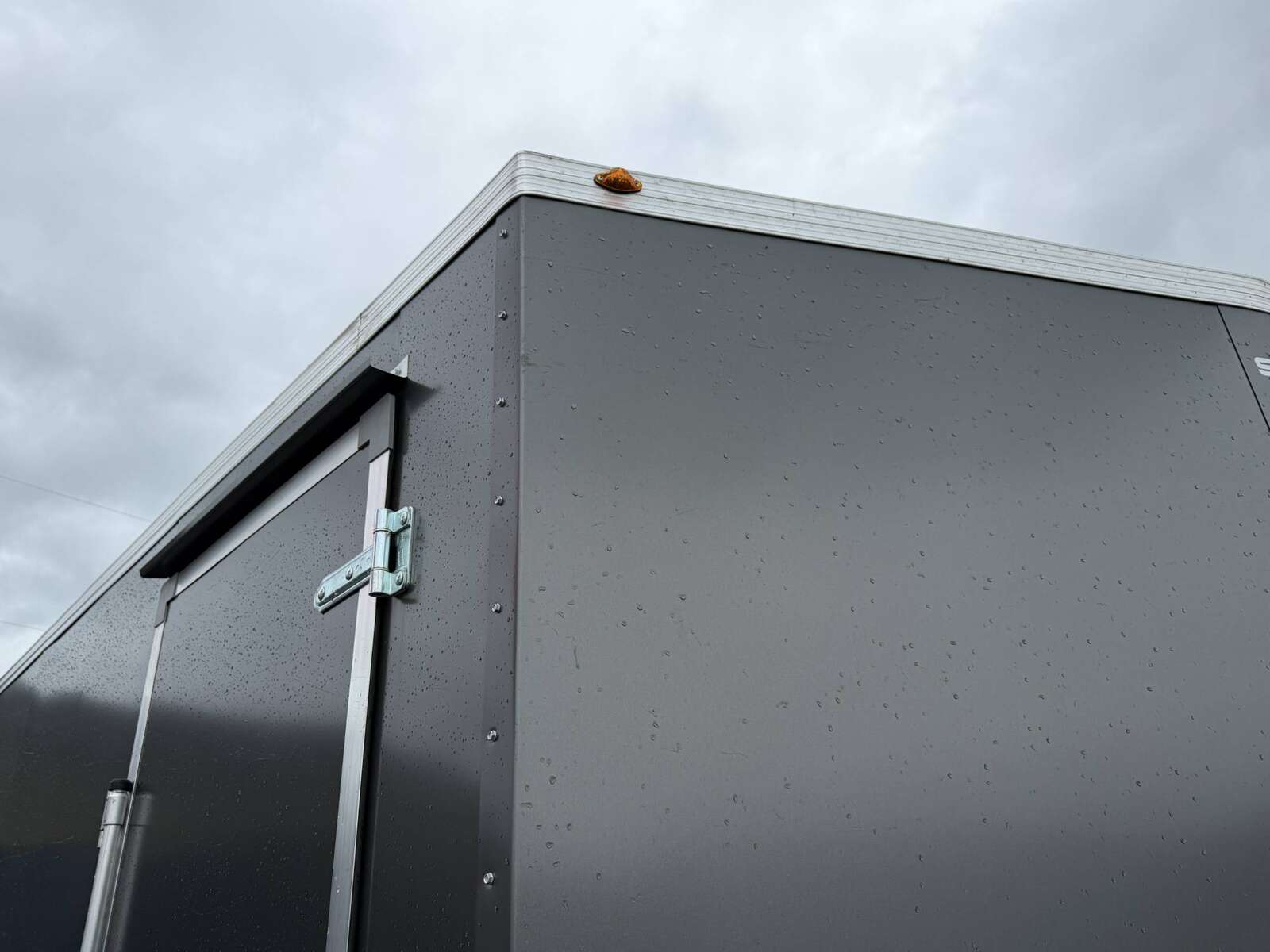 Photo of **SCRATCH SALE** 2026 Royal Cargo 8.5x24 V Nose Car Hauler Cargo / Enclosed Trailer 11,400lb GVW Charcoal Grey Ramp Door Extra Height (GSR)