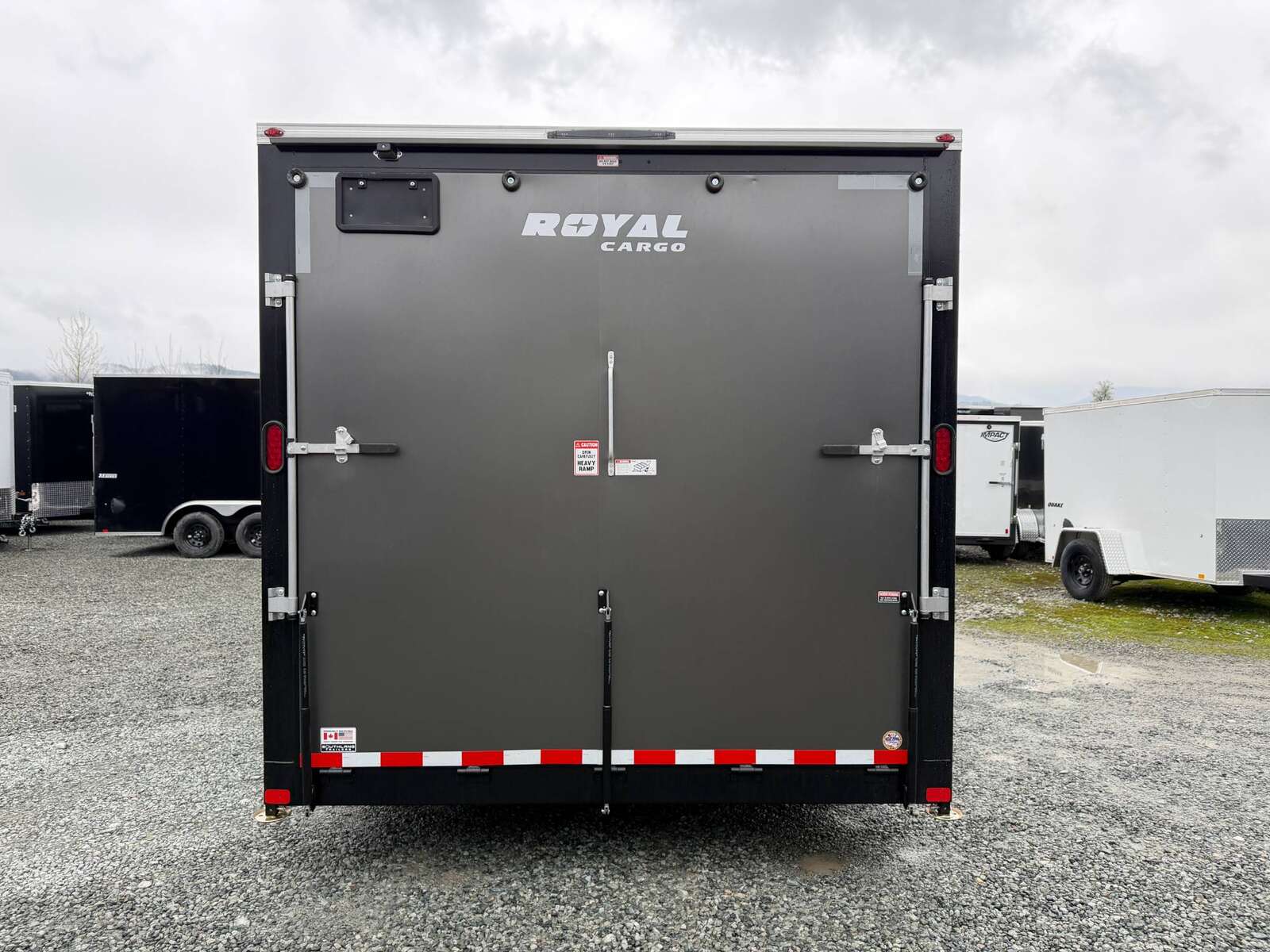 Photo of **SCRATCH SALE** 2026 Royal Cargo 8.5x24 V Nose Car Hauler Cargo / Enclosed Trailer 11,400lb GVW Charcoal Grey Ramp Door Extra Height (GSR)
