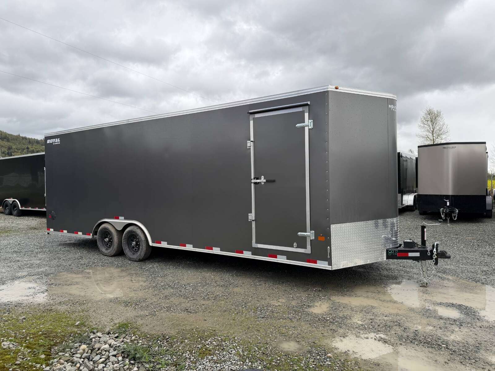 Photo of **SCRATCH SALE** 2026 Royal Cargo 8.5x24 V Nose Car Hauler Cargo / Enclosed Trailer 11,400lb GVW Charcoal Grey Ramp Door Extra Height (GSR)