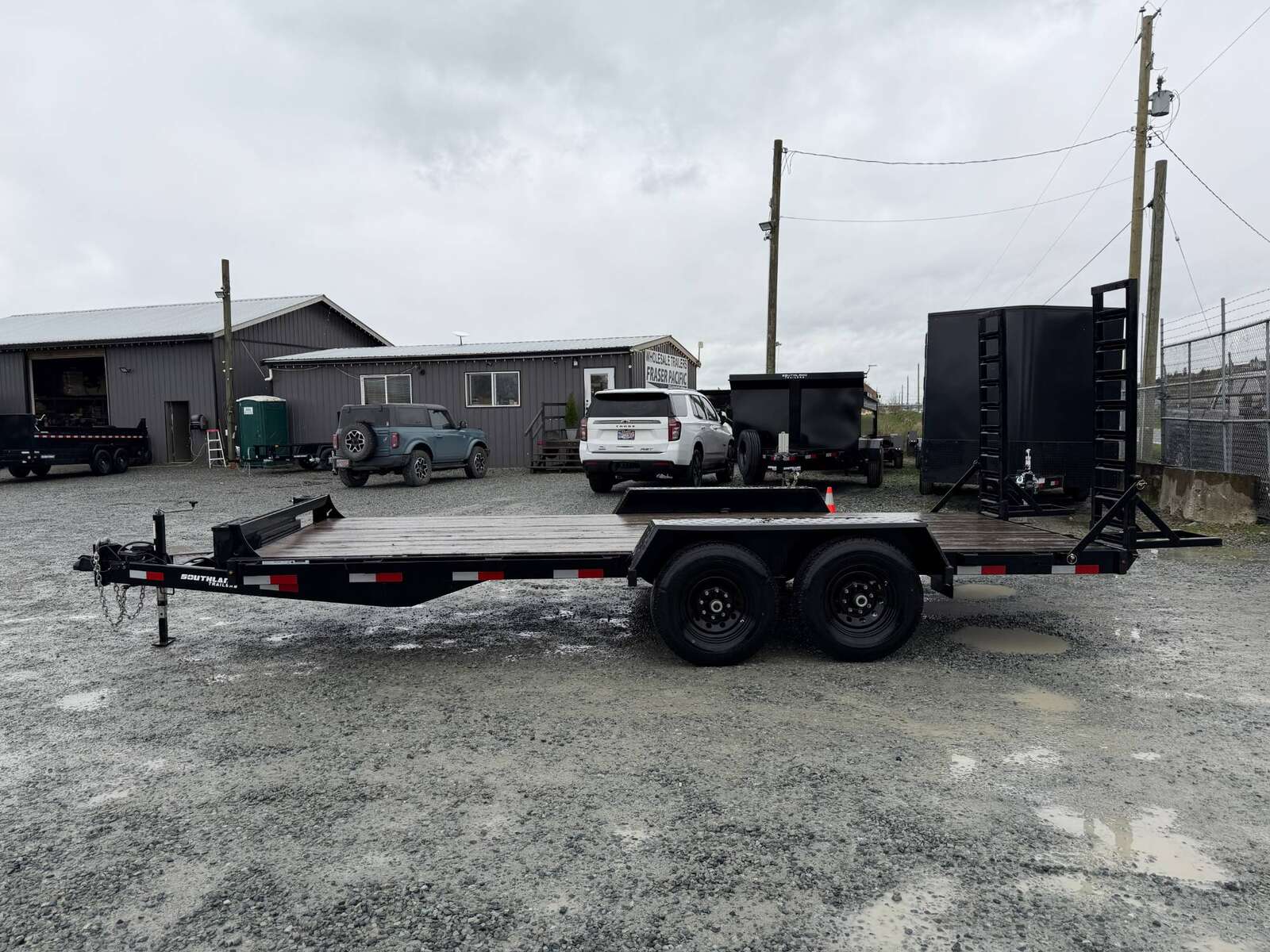 Photo of Pre Owned Used 2024 Southland 7X18 15,400LB GVW Equipment Flat Deck Trailer w/ Stand Up Ramps