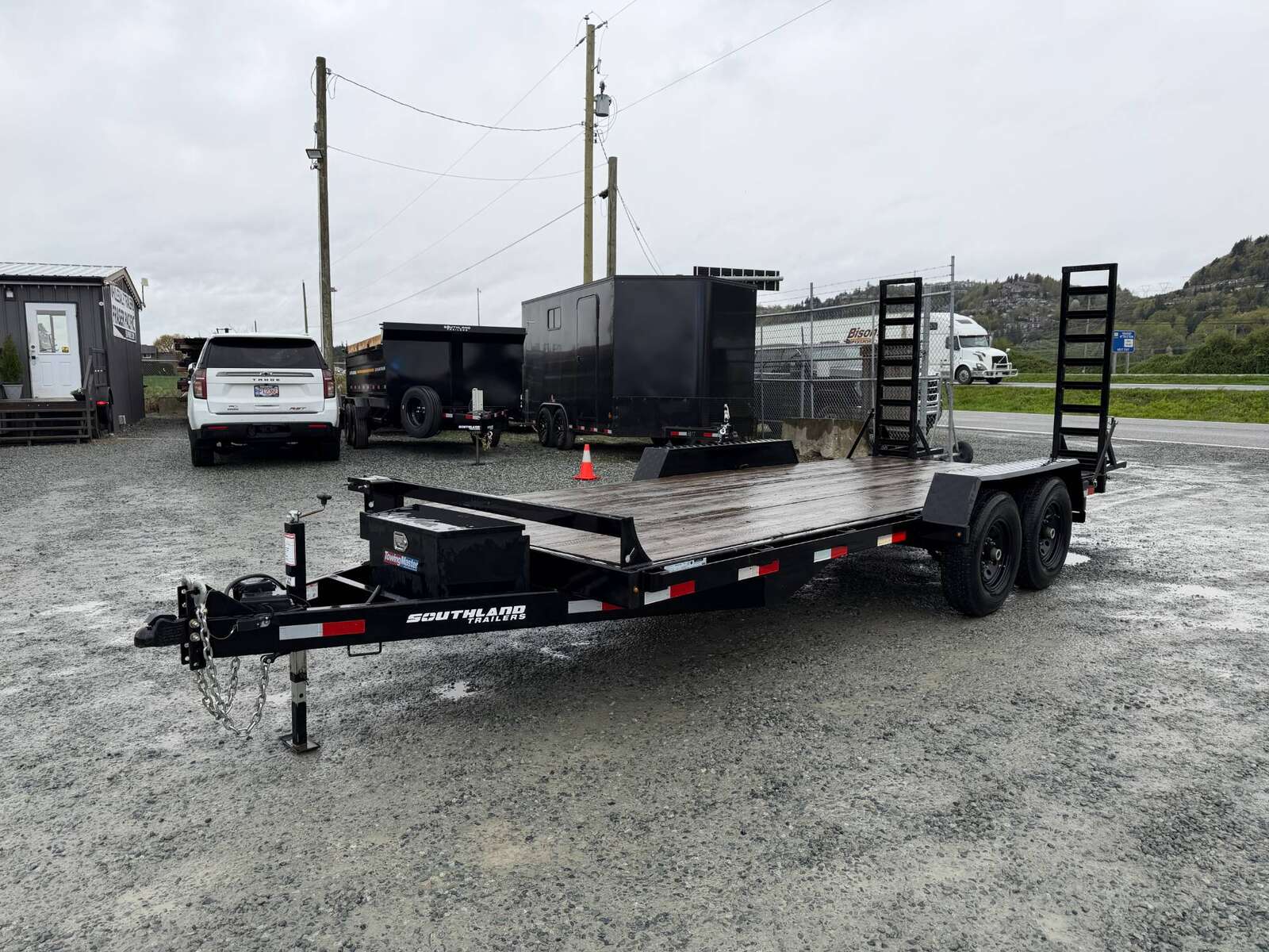 Photo of Pre Owned Used 2024 Southland 7X18 15,400LB GVW Equipment Flat Deck Trailer w/ Stand Up Ramps