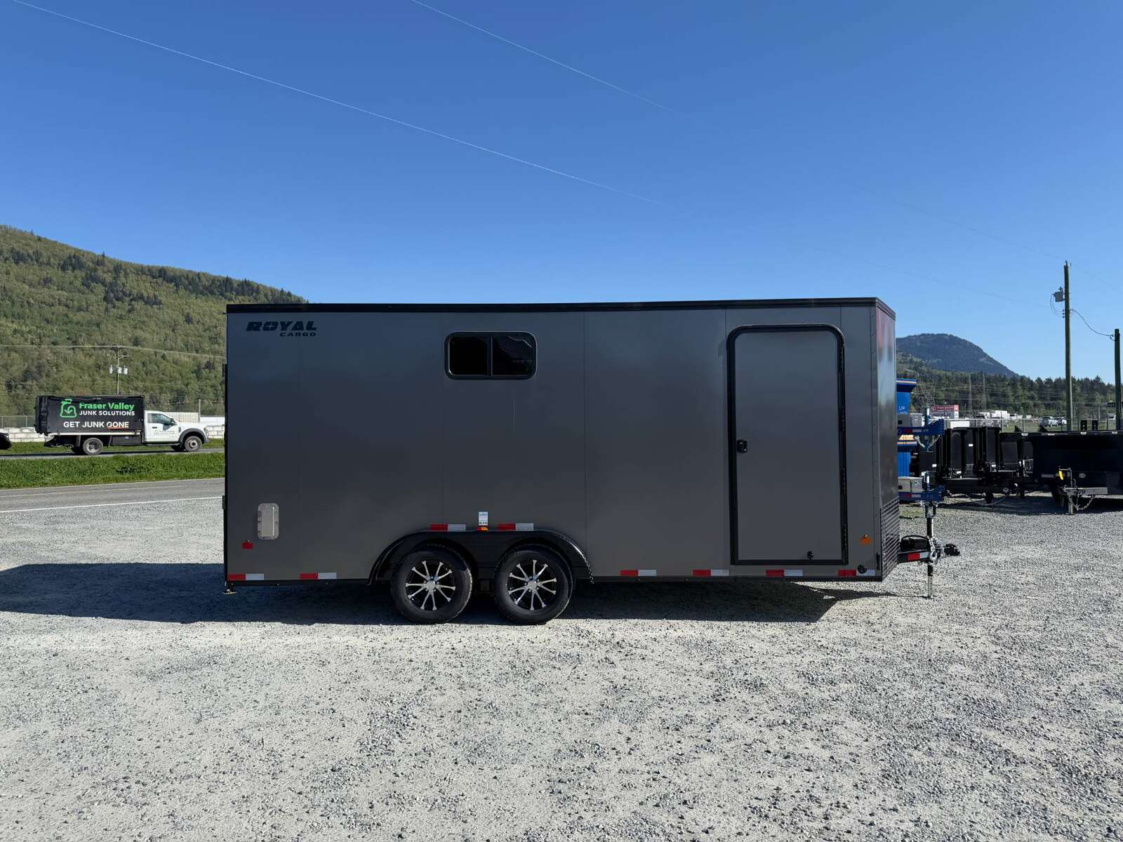 Photo of 2026 Royal 7.5x18 Cargo Enclosed Trailer Insulated Camping Package w/ Black Trim, Side Windows, Ramp Door, Charcoal Grey