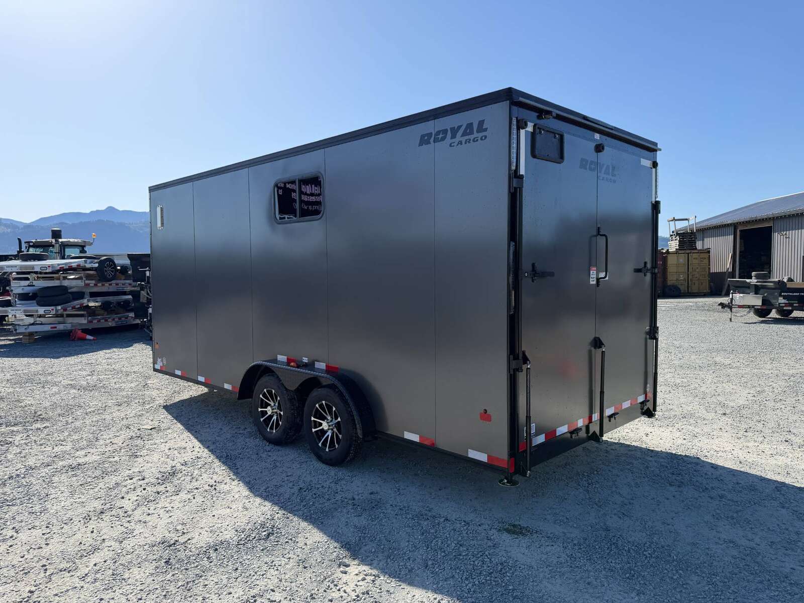 Photo of 2026 Royal 7.5x18 Cargo Enclosed Trailer Insulated Camping Package w/ Black Trim, Side Windows, Ramp Door, Charcoal Grey