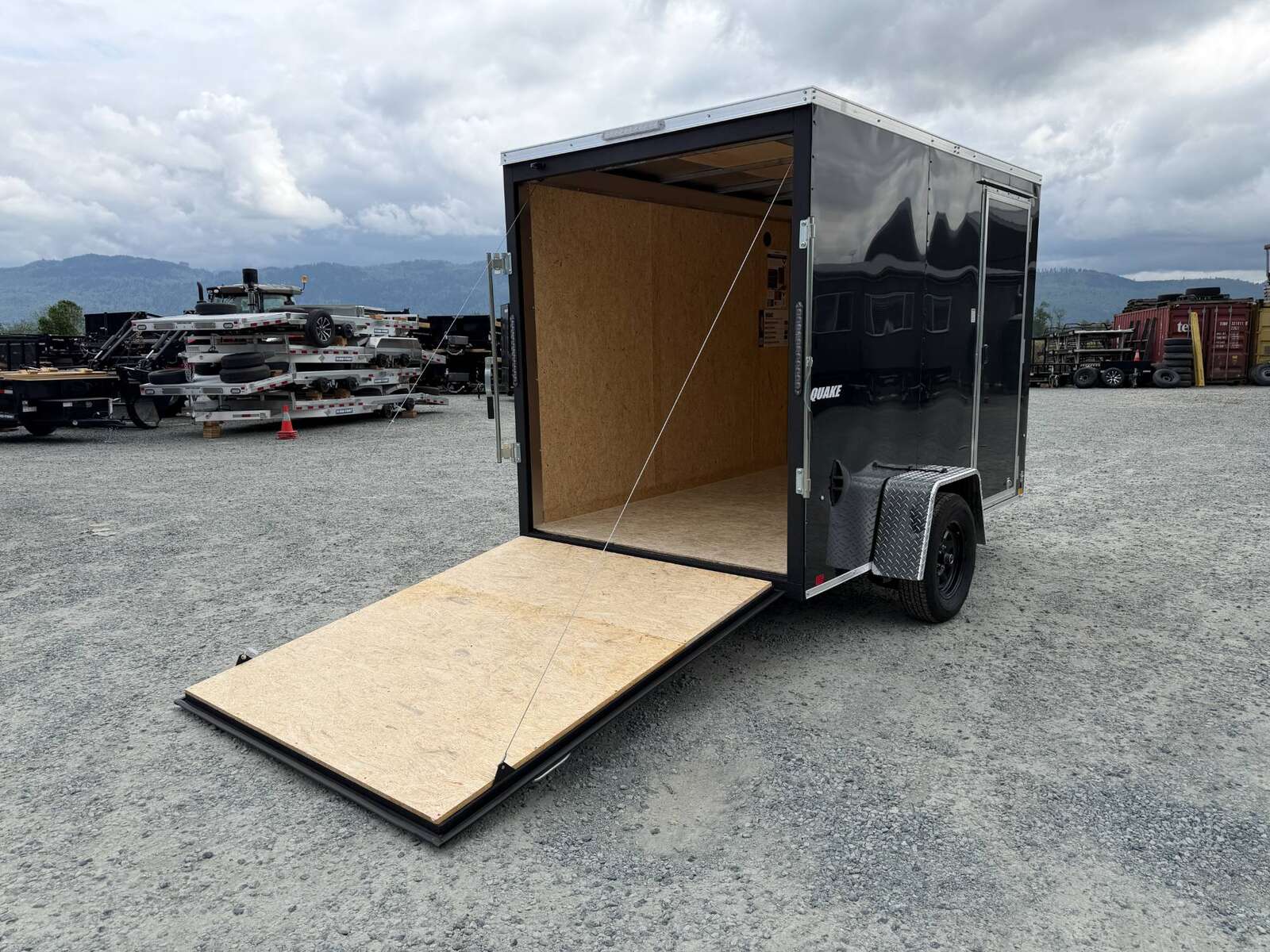 Photo of 2026 Impact Quake 6x10 V Nose Cargo / Enclosed Trailer Black Ramp Door Extra Height 2990lb GVW