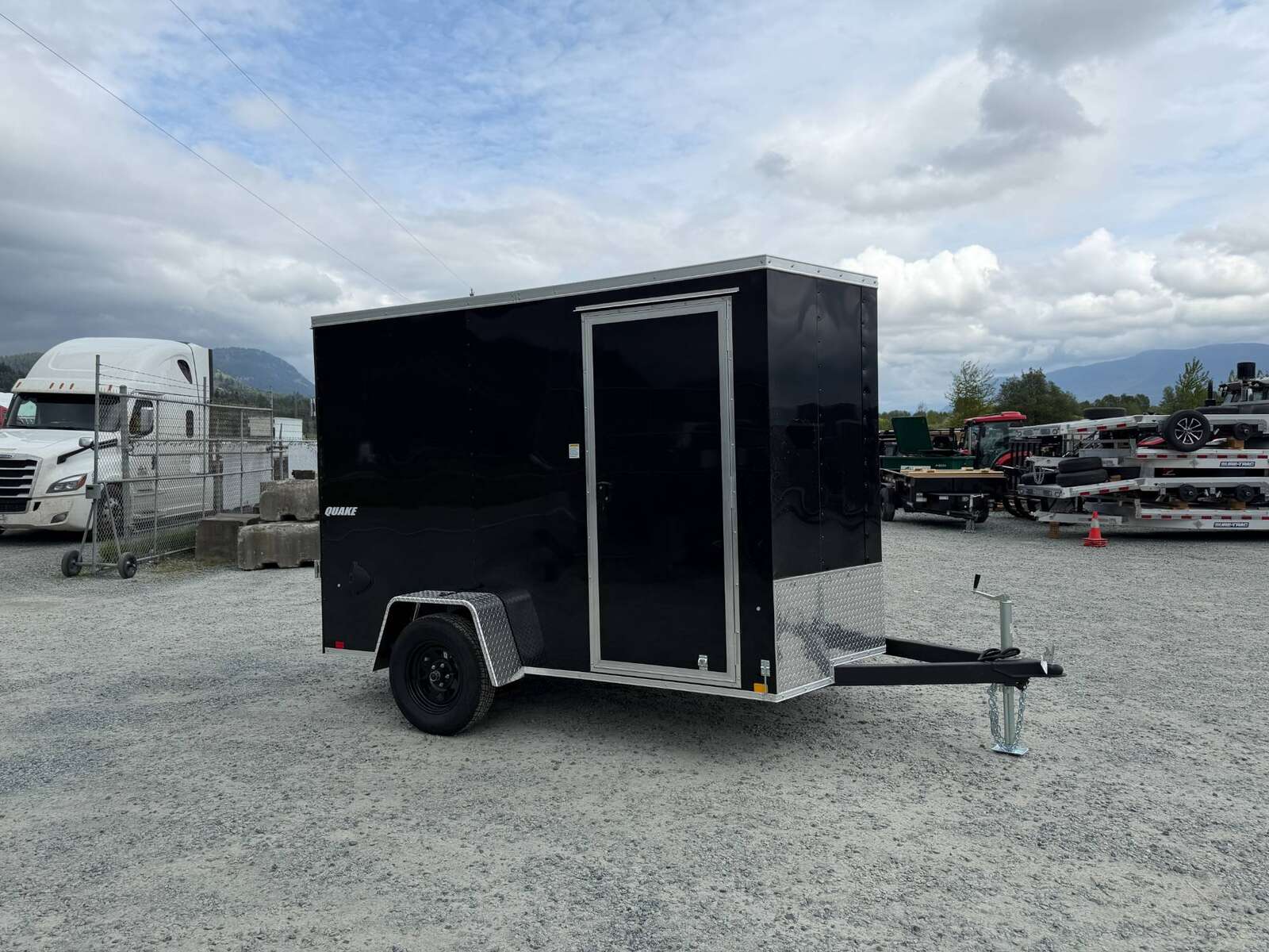 Photo of 2026 Impact Quake 6x10 V Nose Cargo / Enclosed Trailer Black Ramp Door Extra Height 2990lb GVW
