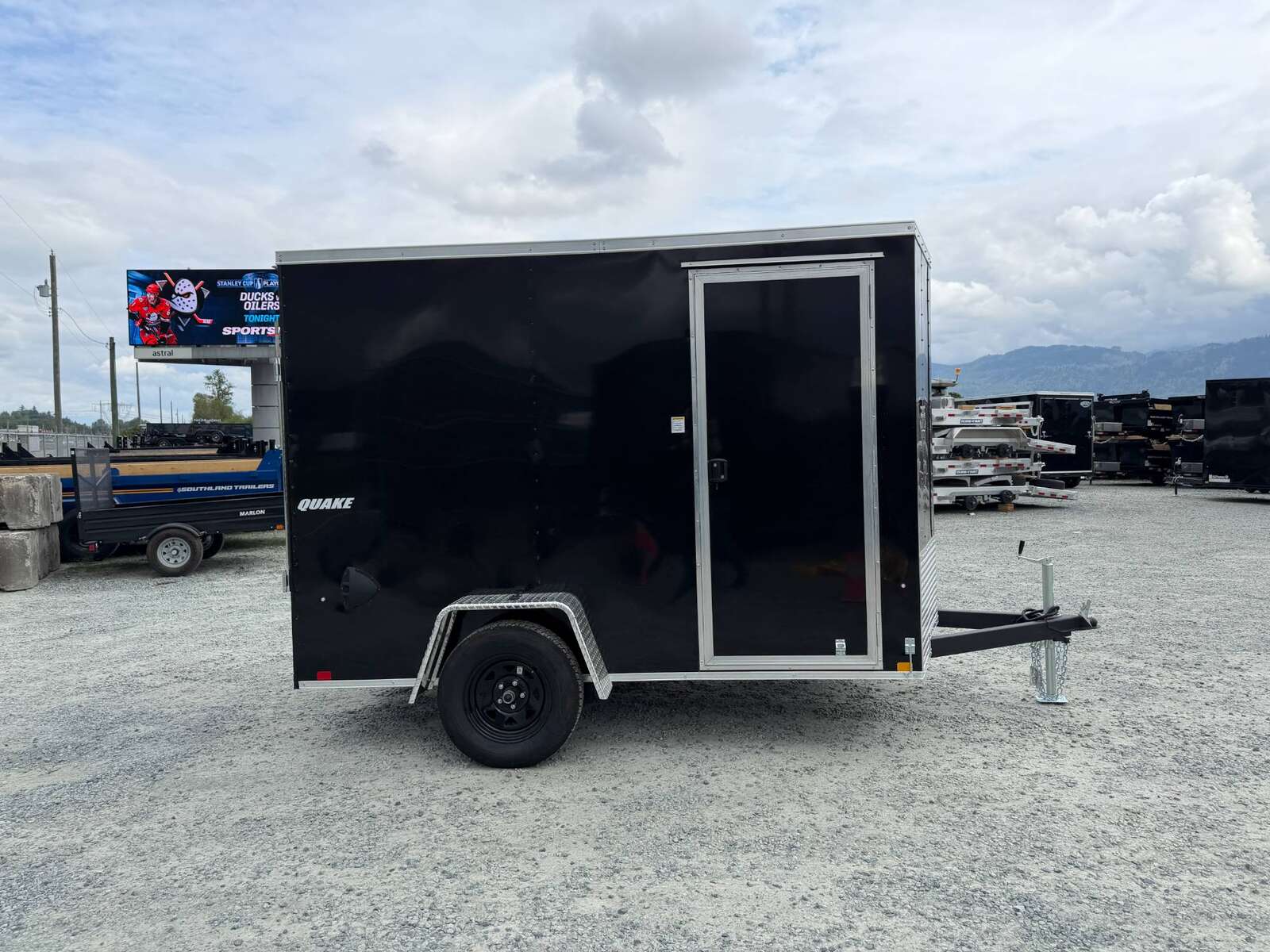 Photo of 2026 Impact Quake 6x10 V Nose Cargo / Enclosed Trailer Black Ramp Door Extra Height 2990lb GVW