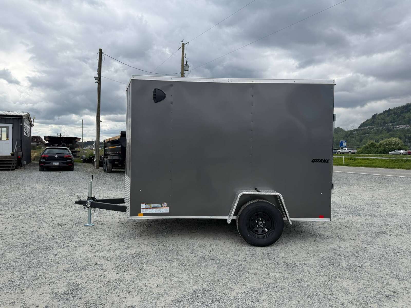 Photo of 2026 Impact Quake 6x10 V Nose Cargo / Enclosed Trailer Charcoal Grey Ramp Door Extra Height 2990lb GVW