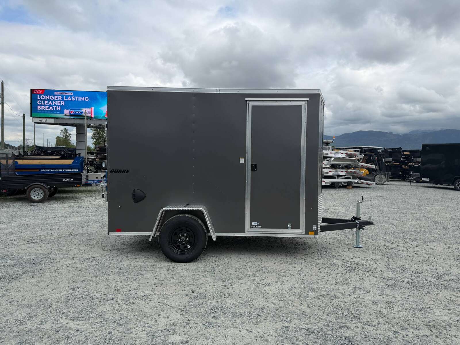 Photo of 2026 Impact Quake 6x10 V Nose Cargo / Enclosed Trailer Charcoal Grey Ramp Door Extra Height 2990lb GVW