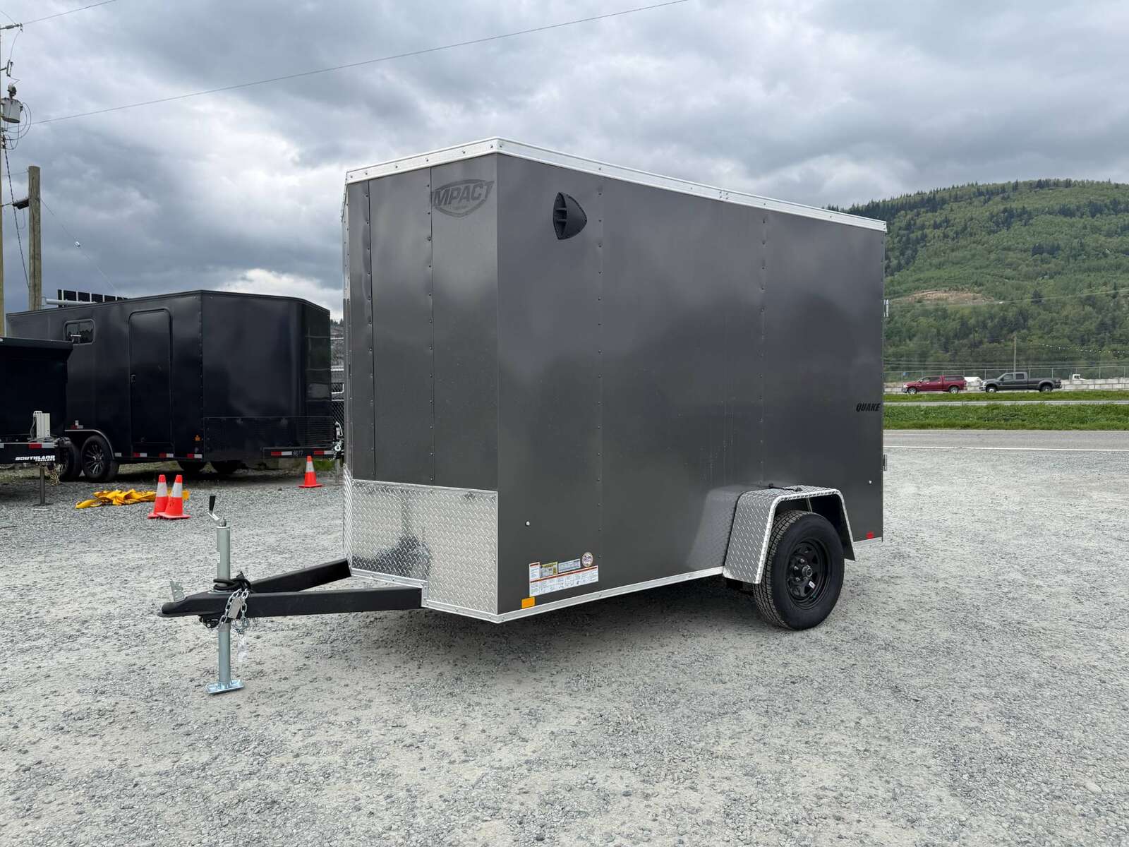 Photo of 2026 Impact Quake 6x10 V Nose Cargo / Enclosed Trailer Charcoal Grey Ramp Door Extra Height 2990lb GVW