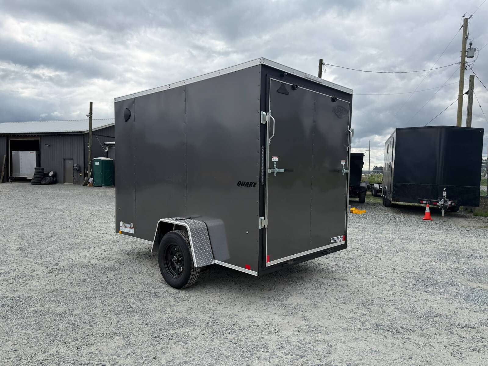 Photo of 2026 Impact Quake 6x10 V Nose Cargo / Enclosed Trailer Charcoal Grey Ramp Door Extra Height 2990lb GVW