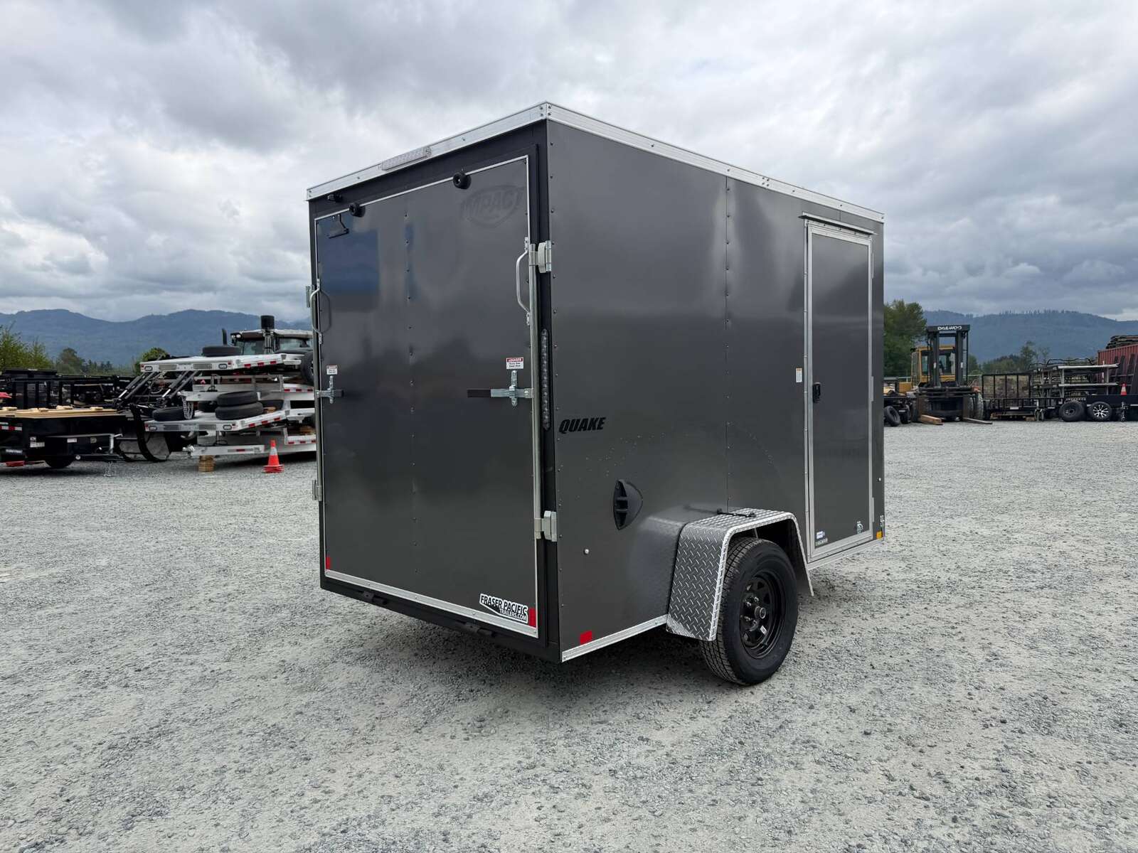 Photo of 2026 Impact Quake 6x10 V Nose Cargo / Enclosed Trailer Charcoal Grey Ramp Door Extra Height 2990lb GVW