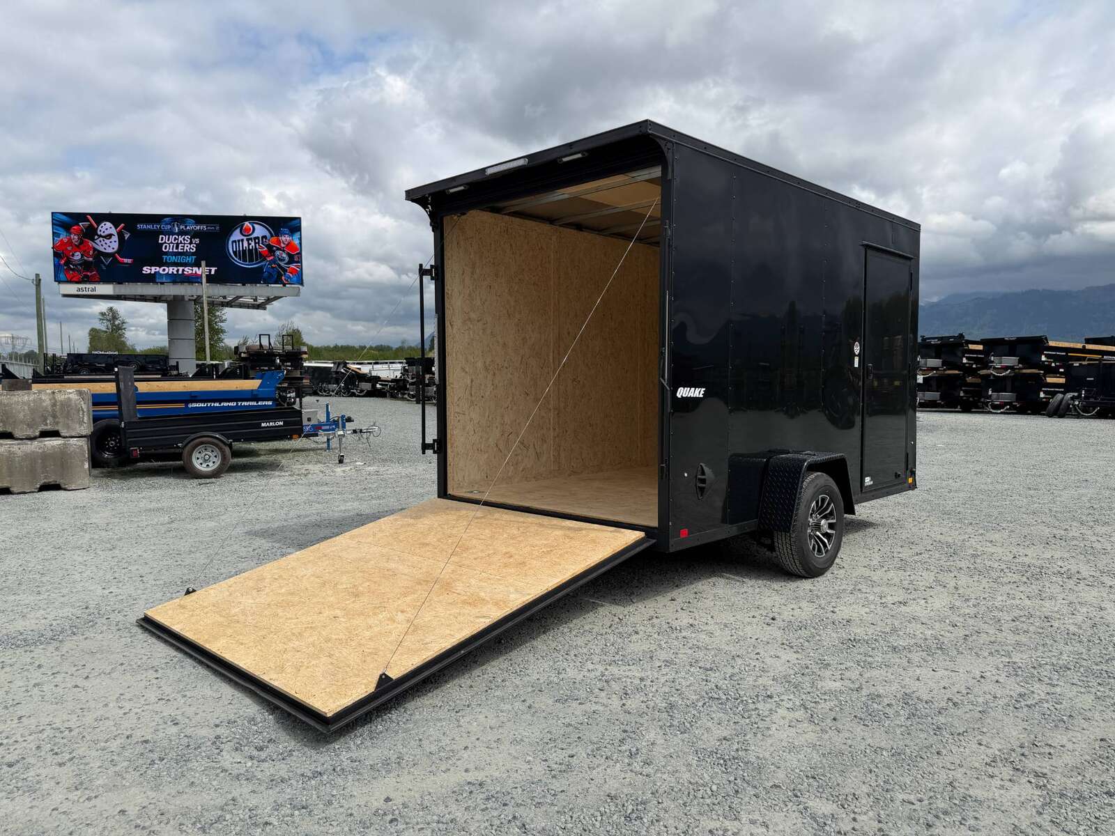 Photo of 2026 Impact Quake 7x12 V Nose Cargo / Enclosed Trailer 5000lb GVW w/ Ramp Door