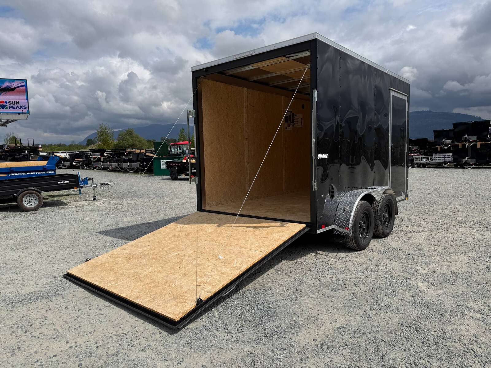 Photo of 2026 Impact Quake 7x12 Cargo Enclosed Trailer Tandem Axle 7000lb GVW Black Extra Height w/ Ramp Door