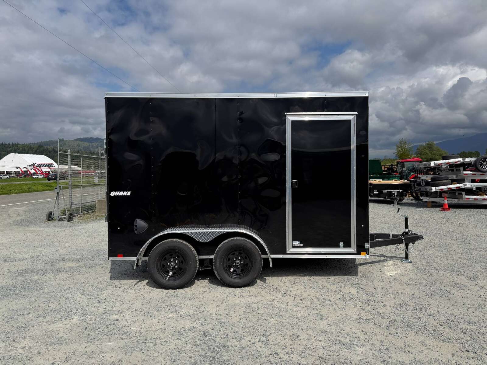 Photo of 2026 Impact Quake 7x12 Cargo Enclosed Trailer Tandem Axle 7000lb GVW Black Extra Height w/ Ramp Door