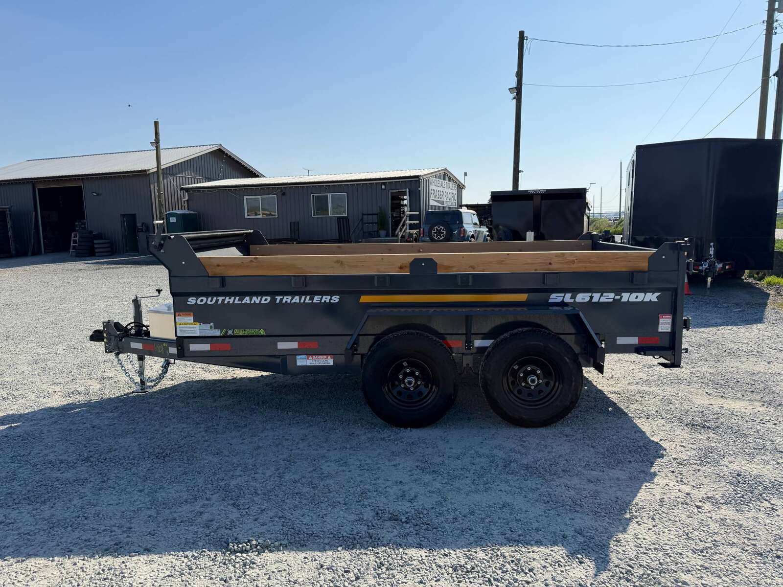 Photo of 2026 Southland 6X12 Dump Trailer 11,400LB GVW with Tarp and Ramps Charcoal Grey