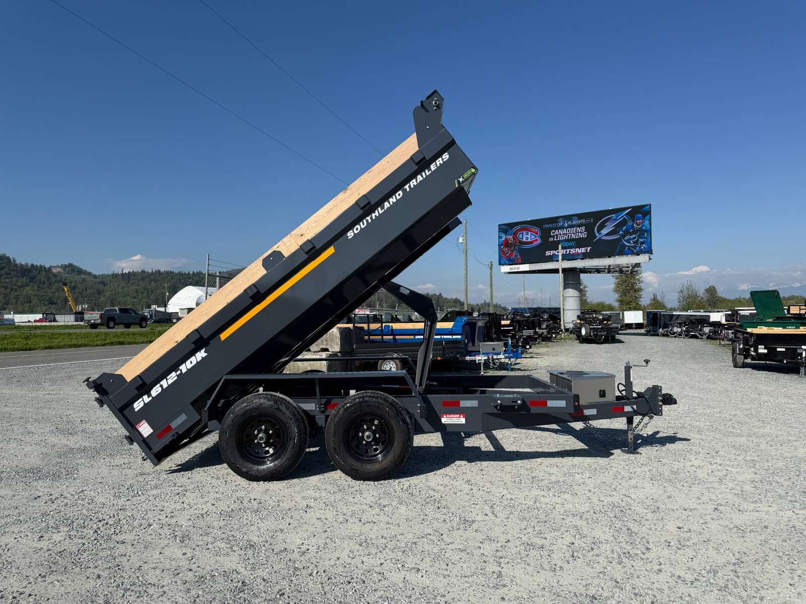 Photo of 2026 Southland 6X12 Dump Trailer 11,400LB GVW with Tarp and Ramps Charcoal Grey