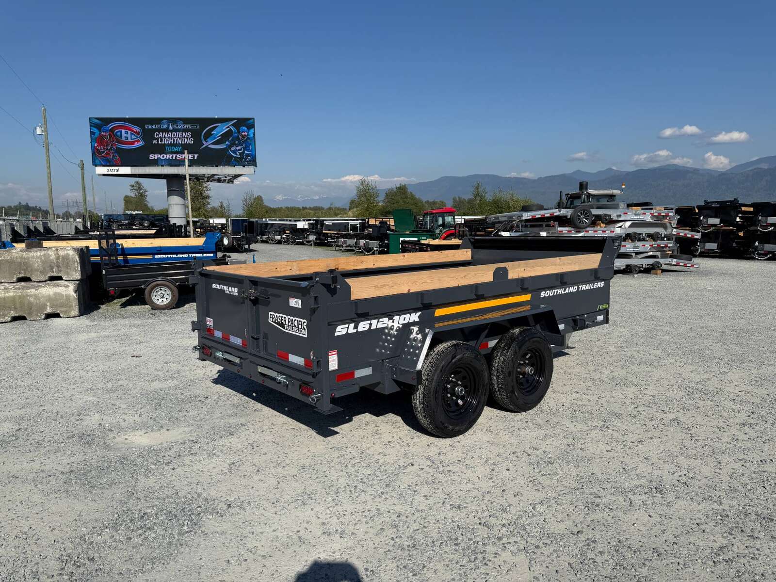 Photo of 2026 Southland 6X12 Dump Trailer 11,400LB GVW with Tarp and Ramps Charcoal Grey
